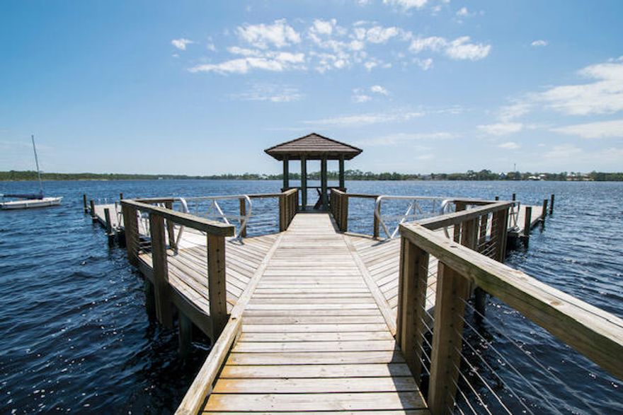 Do not miss out on this premium homesite in the Wild Heron community, ideal for those seeking a serene and luxurious lakeside lifestyle. This beautiful homesite will have front, back and south side views of Lake Powell, Florida's largest coastal dune lake. This lot offers privacy under majestic old oaks and captivating water views. Wild Heron boasts a coastal craftsman charm and is home to the renowned Greg Norman's Shark's Tooth Golf Course, with a future course designed by Davis Love III on the way. A Watersound Club membership is necessary to access these elite golf amenities, making this property perfect for golf enthusiasts and nature lovers alike. Wild Heron provides an exceptional living experience with world-class amenities, including 24-hour security, a gated entrance, a lakeside grill and fire pit, a community swimming pool, fitness center, and nature trails. The Wild Heron community is conveniently located on the west end of Panama City Beach, which is just minutes from Pier Park and the renowned 30A area. Offering a tranquil, family-friendly atmosphere, Wild Heron prohibits short-term rentals, ensuring a peaceful and private environment for its residents.
