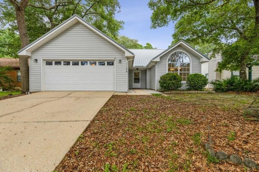 Nestled in the heart of Niceville!  This charming ranch home is convenient to EVERYTHING...Eglin AFB, EOD School, Destin-FWB Airport, shopping, parks, schools, eateries & minutes to sugar-white, sandy beaches!  Sunny, light-filled kitchen features vaulted ceiling, island & enormous window perfect for birding!  Primary bath has double vanities & new shower-surround!  Gas fireplace!  Metal roof!  Shady backyard comes complete with shed/workshop & lemon trees!  Washer/Dryer stay!  Make an appointment today to see this one...there is lots to love!