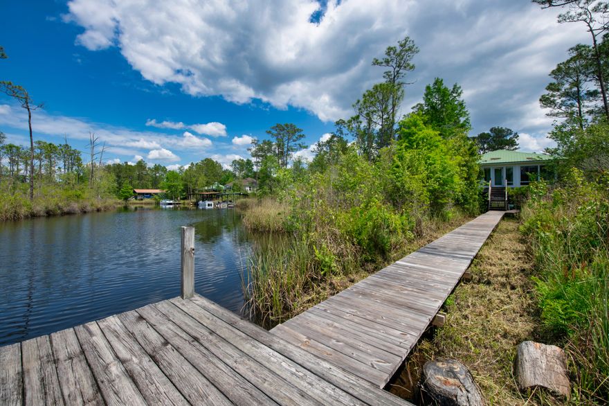 Don't miss your opportunity to own this beautiful WATERFRONT home at an unbelievable price, this is truly the best of both worlds!! Nestled on the Alaqua Creek you have access to the Bay by boat making this perfect for boaters and nature lovers alike. The home has a 50 ft dock and is located near two boat launches. The Florida room overlooks the dock and provides a great setting to enjoy the scenery and sunsets for years to come.