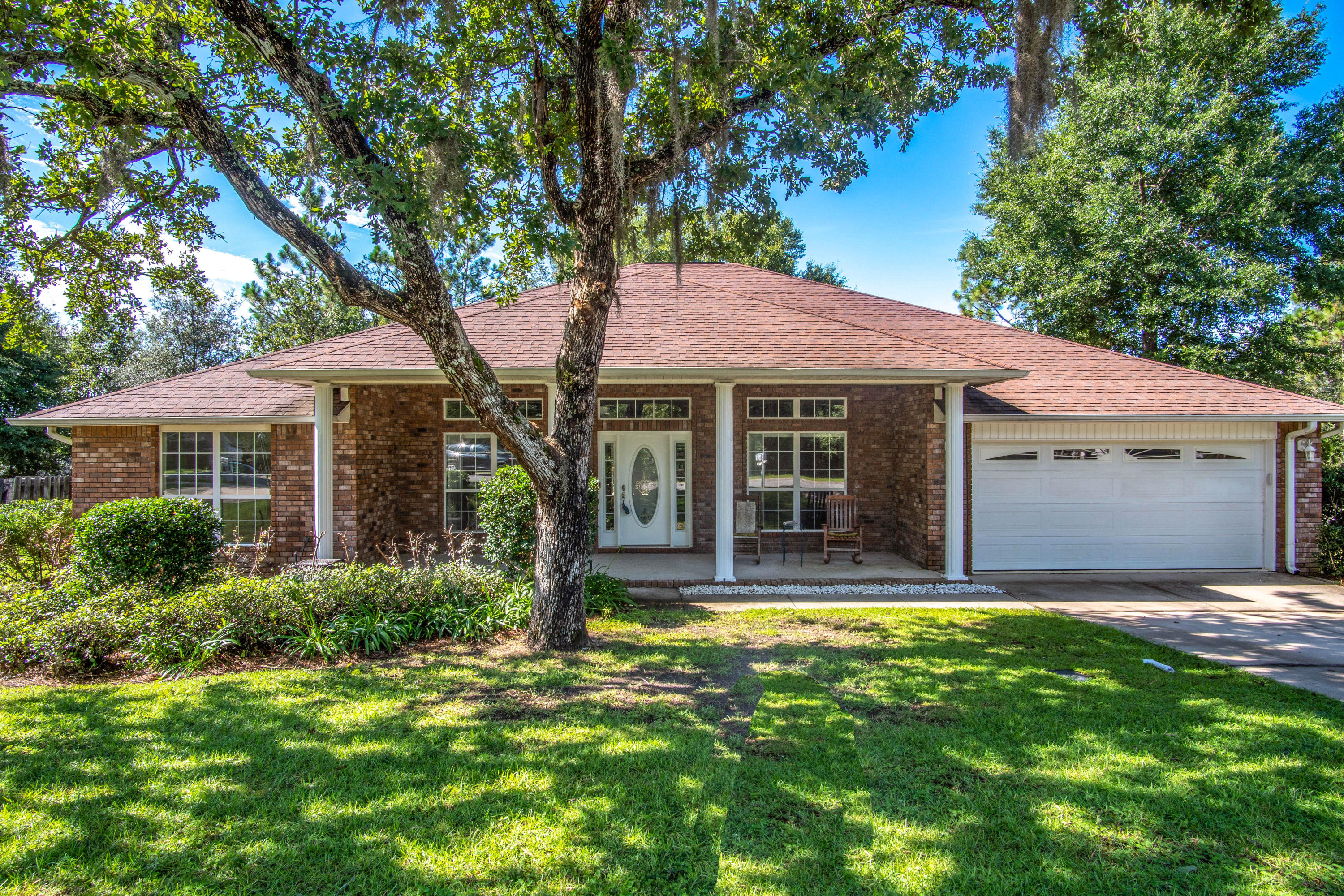 Spacious open floor plan, all brick one story home, tucked away in Fox Valley - a sought after community in south Crestview! This home has a split floor plan, game room, 4 bedrooms, 3 full bathrooms, and a HUGE kitchen! The master bedroom can fit large furniture and you will enjoy the completely remodeled master bathroom with tiled walk in shower with rain shower head, dual sinks, granite, tile flooring all done in a neutral pallet. The shower is surrounded by seamless glass and a low profile entry for easy entry. The backyard is ample sized for gatherings with a deck and plenty of play space. There is a wooded buffer between this home and the homes behind it for ample privacy. The garage is insulated, heated and cooled, and has a damper for all you woodworking, or car enthusiasts! The HVAC is 5 ton and less than 1 years old and there are gutters around the entire home!