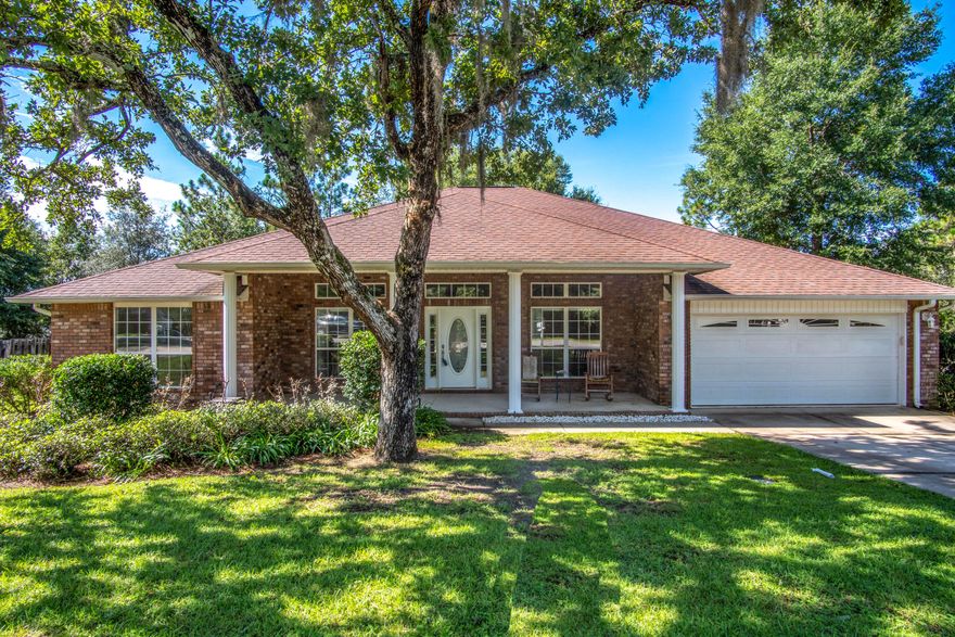 Spacious open floor plan, all brick one story home, tucked away in Fox Valley - a sought after community in south Crestview! This home has a split floor plan, game room, 4 bedrooms, 3 full bathrooms, and a HUGE kitchen! The master bedroom can fit large furniture and you will enjoy the completely remodeled master bathroom with tiled walk in shower with rain shower head, dual sinks, granite, tile flooring all done in a neutral pallet. The shower is surrounded by seamless glass and a low profile entry for easy entry. The backyard is ample sized for gatherings with a deck and plenty of play space. There is a wooded buffer between this home and the homes behind it for ample privacy. The garage is insulated, heated and cooled, and has a damper for all you woodworking, or car enthusiasts!  The HVAC is 5 ton and less than 1 years old and there are gutters around the entire home!