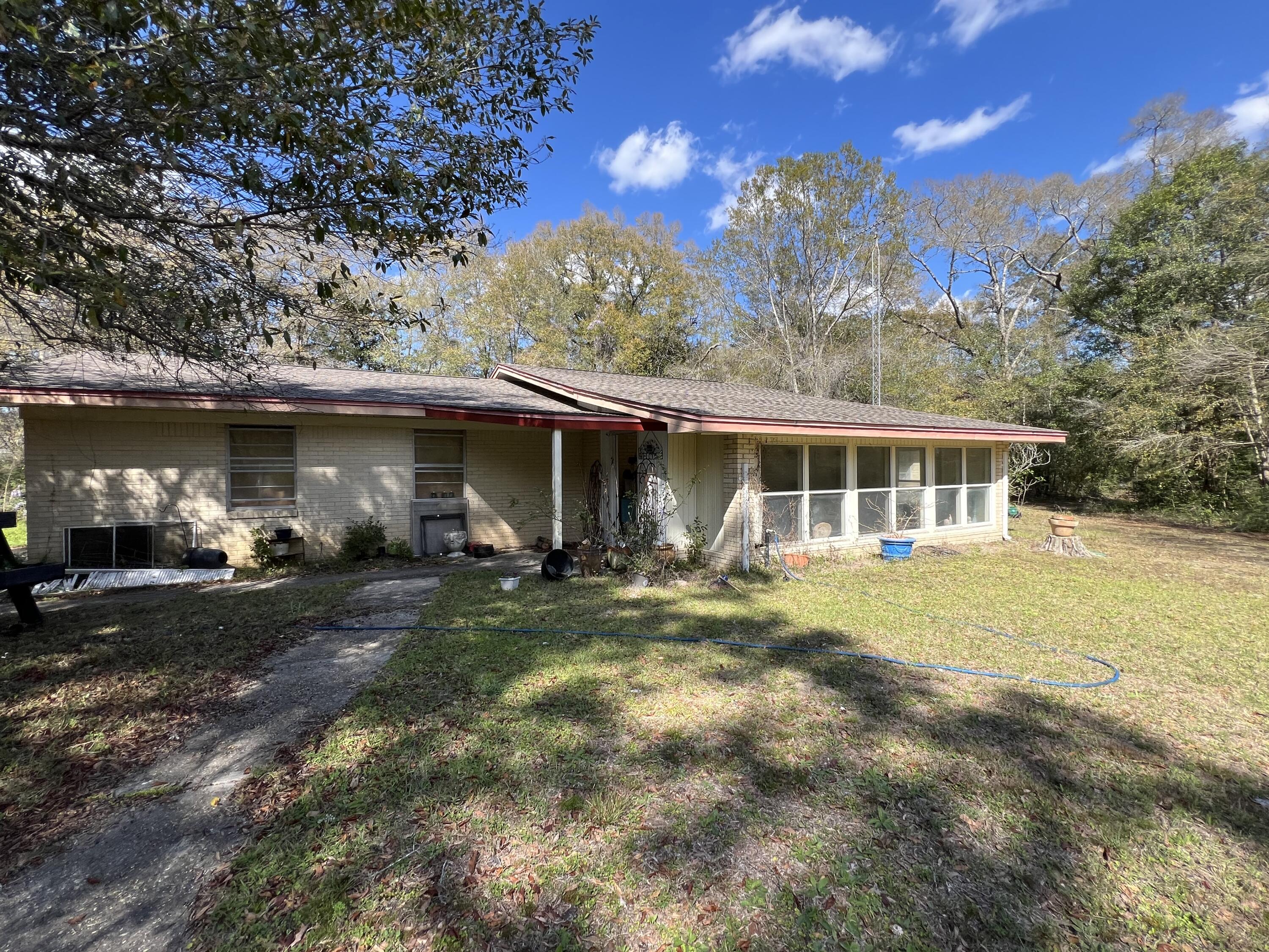 Located just north of Crestview, this homesite is one of very few 100+ acres available in Crestview. This sale includes the purchase of 3211 Maple St, a 2042SF brick home built in 1967 with 3 bedrooms and 2 baths. A new roof was installed in 2020. This parcel is a majority of the acreage at over 100 acres. The second home, 3205 Maple St was built in 1963 and has wood/vinyl siding 2 bedrooms 1.5 baths and is 980sf and a roof was installed in 2023. Due to the combination of properties, acreage size, limited financing is available. A definite must consider if looking for your next build site, farm, pasture or possible subdivision. Homes are being sold as is. Call today.