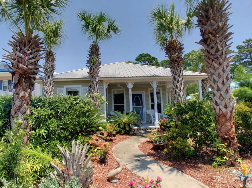 This charming Florida cottage is located in this desirable ''walk to the beach'' neighborhood of Sea Dunes off 30A. When you enter this lovely home you feel welcomed by an open and spacious living room, dining area and kitchen with ceramic tile flooring. The kitchen has a large breakfast bar and was just upgraded with New Stainless Appliances, granite countertops, back splash, under cabinet lighting and double stainless sink with upgraded fixtures and new disposal. New LTV Hickory Sand flooring in all the bedrooms and new paint throughout the home, inside and out. The master bedroom has a new built-in cabinet creating lots of storage as well as a full bath with double vanity and private door accessing the back deck. Large garage with custom built in cabinets.