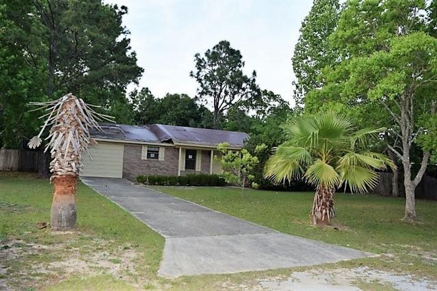 Real Estate Owned REO. Corner lot over a half acre with this 3 bed 2 bath all brick home. Tiled entrance-kitchen/ Dining combo-pantry in kitchen. Great room has bricked wood burning fireplace. Nice size bedrooms with skylight in master bath. Garage was used previously as additional sq ft but could easily be converted by buyer back to garage if desired, garage area/bonus room has wash and dryer hookup and cabinet space. Privacy fenced back yard.