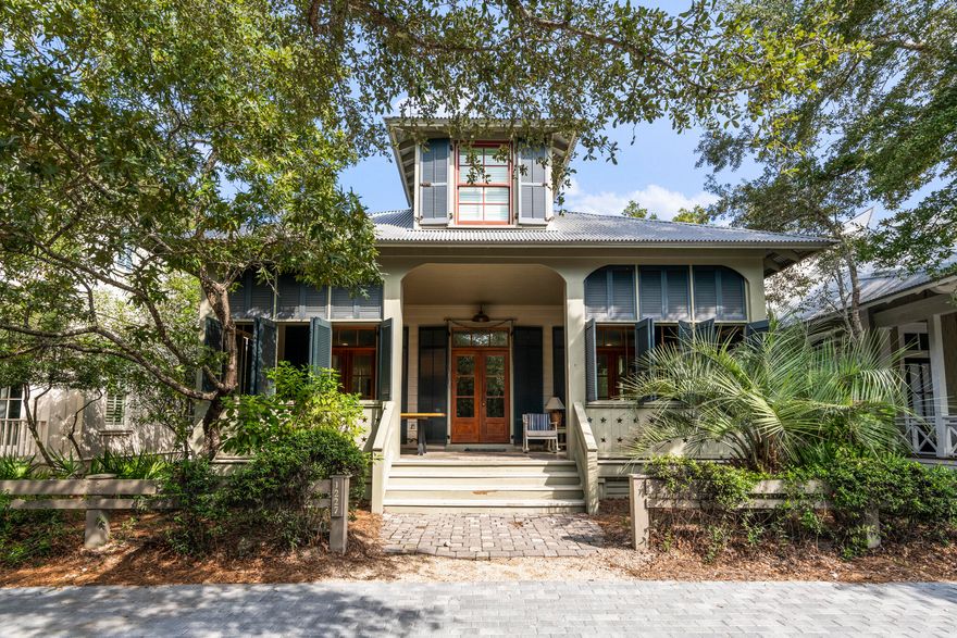 Primely positioned in Watercolor's Camp District, this is coastal living at its finest. The beaches of WaterColor are just a short bicycle ride or walk away, as are so many WaterColor amenities such as the Tennis Center, the Boat House and the spectacular neighborhood pool. This lovely home offers a gourmet kitchen which features stainless steel appliances, a gas stove and wooden butcher block countertops. The kitchen transitions into a beautifully appointed dining room and living room. The fourth bedroom doubles as a second living area, and features a TV/stereo entertainment center. Friends and family can kick back under the ceiling fans on the furnished porch after a day on the beach. Starting on the first floor, the primary suite has a king bed, a TV ensemble and its own bath which features a separate claw-foot tub and shower. The second bedroom has a king bed, a TV entertainment center, and also has its own bath with a shower only. The third bedroom has a double bed and a shower bathroom with a single vanity. The fourth bedroom, which is on the second floor, has two full over full bunk beds and queen sleeper sofa, a shower bathroom with a double vanity. The separate den is a favorite with the kids. An outdoor shower is the perfect place to rinse off after a day at the beach. This home also has an outdoor propane grill and a car port.

SLEEPING ARRANGEMENTS:
FIRST FLOOR:
- Primary Bedroom: King, Private Bathroom with Shower and Tub
- Guest Bedroom: King Bed, Private Bathroom with Shower Only
- Guest Bedroom: Full Bed, Private Bathroom with Shower Only

SECOND FLOOR:
- Guest Bedroom: Two Full over Full Built In Bunk Beds and Sleeper Sofa, Private Bathroom with Shower Only

WATERCOLOR NEIGHBORHOOD HIGHLIGHTS:
- Named the #1 family vacation destination in the U.S.
- A 499-acre coastal resort and residential community
- Ideal bike community perfect for family getaways
- Pristine sugar sand beaches
- 6 swimming pools
- Pickle ball courts
- Award-winning tennis facilities
- Championship golf nearby
- World Famous Beach Club
- Unparalleled beachside, poolside, and lakeside dining
- Acres of parks, gardens, and footpaths
- Nearby state parks and preserves
