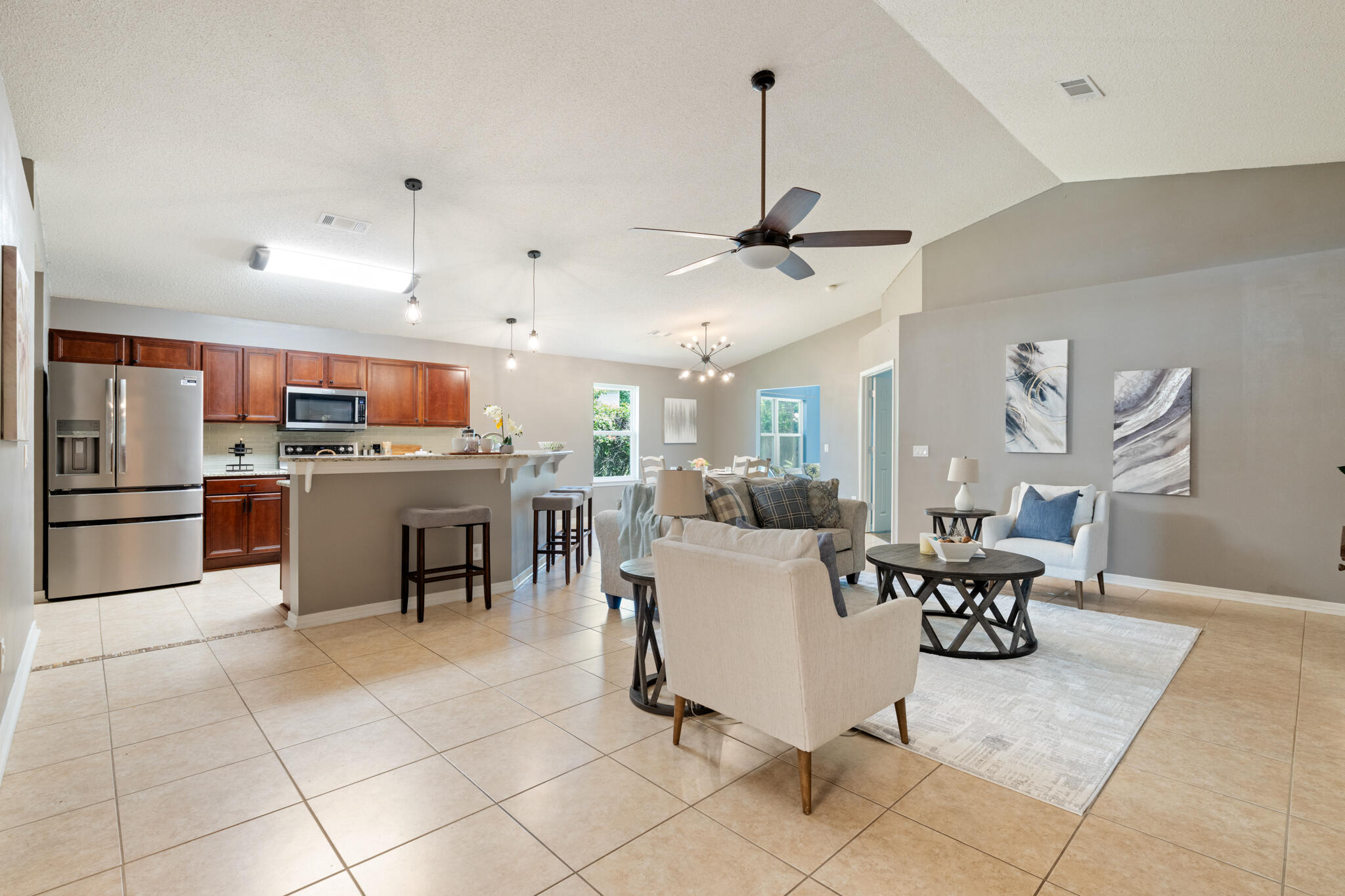 Tucked away in the quiet, family-friendly neighborhood of Hidden Shores, this beautifully maintained 3-bedroom, 2-bath home offers a rare blend of tranquility and convenience--plus a stunning lakefront setting that makes everyday living feel like a retreat. Step inside to an open and inviting floor plan where the living, dining, and kitchen areas flow seamlessly together. Oversized windows frame views of the lake and its peaceful fountain, filling the space with natural light. The kitchen is both stylish and functional, featuring granite countertops, a sleek glass tile backsplash, a new Frigidaire refrigerator, and a full suite of stainless steel KitchenAid appliances all less than five years old. A wraparound hop-up breakfast bar invites conversation, while a spacious pantry and indoor laundry room add to the home's everyday ease.
Enjoy peace of mind with major upgrades already taken care of, including a 2020 roof, impact-rated windows and doors installed in 2022, a whole-home drinking and water filtration system, and a brand-new hot water heater (2025). The primary suite is a true retreat with a large walk-in closet and a beautifully remodeled ensuite bath that includes solid-surface double vanities, a jetted garden tub, and a separate tiled shower (2023). Two additional bedrooms with laminate flooring and a guest bath with quartz countertop ensure comfort for everyone no carpet in sight.
Step outside to your private backyard oasis where mature trees offer shade and privacy from neighbors. An expansive patio overlooks tropical landscaping and a picturesque lake with a lighted fountain. Follow your own gated path for direct access to the lake perfect for peaceful walks or simply enjoying the view.
Enjoy the best of both worlds: serene surroundings with convenient access to it all. Commuting is a breeze to Hurlburt Field and to NAS Pensacola.