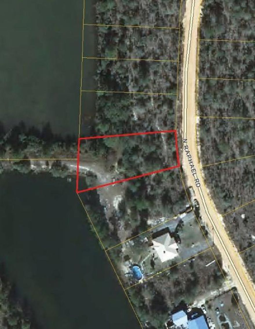 Buildable waterfront lot opposite the dam in Oakwood Lakes. The lot fronts both the dam and a pond. The lots on both sides of the property have been surveyed and flagged.