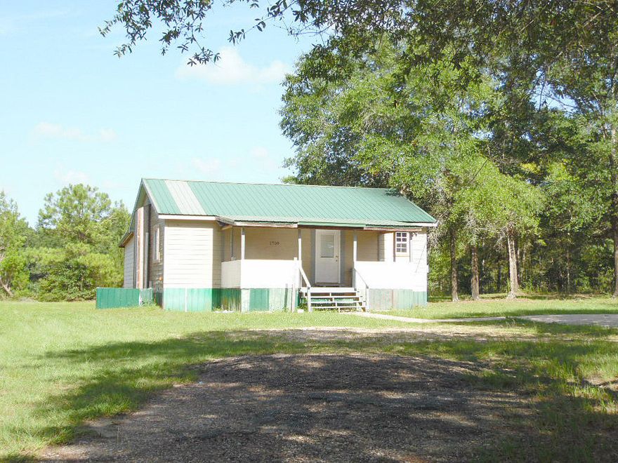 This is a 3 bedroom, 1.5 bathroom cottage on 2.1 acres located on a corner! Enjoy the large covered front porch that leads into the foyer. The master bedroom has both an attached half bathroom and over sized walk in closet. This home has had some renovations done recently like fresh paint, new flooring, new hot water heater, new plumbing & electrical for utility room, new fixtures and the HVAC is less than two years old. The home still needs TLC but that is represented in the listing price. The yard is gorgeous with the entire two acres being cleared with select trees and bushes left for landscaping. Make your appointment for a private tour today!