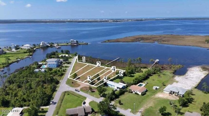 Waterfront Lot with Gulf Access - Rare Opportunity in the Panama City area. Discover the perfect blend of seclusion and convenience with this stunning waterfront lot located in Callaway on the east end of Panama City. Just minutes from Tyndall Air Force Base and only a 30-minute drive to the white-sand beaches of Panama City Beach, this property offers a peaceful escape while keeping you close to everything the area has to offer. This is one of six prime waterfront lots available--buy one, two, or all six for an incredible investment or development opportunity. Each lot offers direct Gulf access, and this particular lot features its own dock, making it ready for you to build your dream home right away.