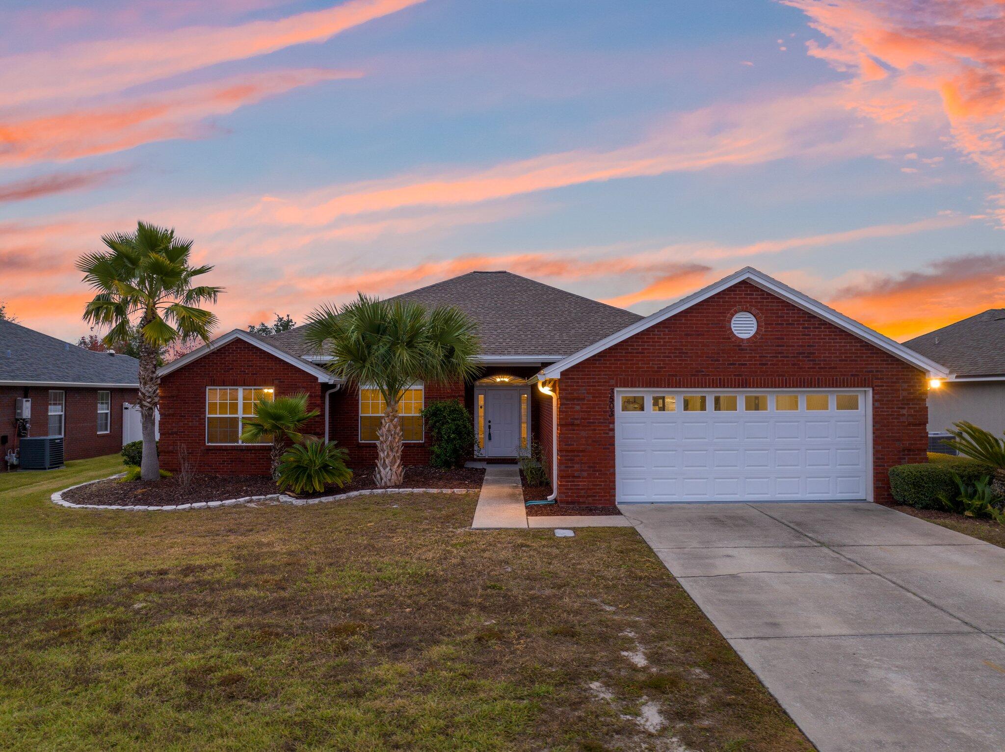 Welcome to The Hammocks! This stunning 4-bedroom, 2-bathroom, a spacious 2,086 sqft, home offers the perfect blend of style, comfort, and convenience in a sought-after sidewalk community with a sparkling pool. Located just a short walk to A. Crawford Mosley High School and Bay Haven Charter Academy, this home is ideal for those seeking a vibrant neighborhood with great amenities. Step inside to discover tall ceilings throughout, creating a spacious and airy feel. The living room offers ample space for relaxation and entertaining, complete with built-ins for added functionality and style. Spacious kitchen equipped with stainless steel GE appliances, a breakfast bar perfect for meal prep and sharing meals together, a cozy breakfast nook, and a walk-in pantry. The inviting Florida room offers plenty of natural light and serves as a versatile space for hobbies, relaxation, or simply enjoying serene views of nature. The primary suite is a true retreat with tall ceilings, an elegant accent wall, and a spa-like en-suite bathroom featuring a double sink vanity, a soaking tub, and his-and-hers walk-in closets. Step outside to the fully fenced backyard, where you'll find an open cobblestone patio, perfect for entertaining, grilling or, adding beautiful patio furniture. You'll find a thriving citrus tree, creating the perfect back yard space for outdoor entertaining or quiet afternoons. The oversized garage, measuring 29 feet by 21 feet 3 inches, provides ample room for two vehicles and additional storage. This home is move-in ready with recent updates, including a new roof installed in 2019 and a Coleman 3.5-ton, 14.3 SEER2 HVAC heat pump system installed in June 2024. The location is unbeatable, with Bay Haven Charter Academy just 4 minutes away, Mosley High School 3 minutes away, and Publix Super Market only 8 minutes away. Additionally, you'll be 30 minutes from Tyndall Air Force Base and 31 minutes from the white sandy shores of Panama City Beach. Enjoy strolling through this beautiful neighborhood, exploring the mini library, and cooling off in the community pool on warm summer days. Don't miss your chance to make this gorgeous home yours.