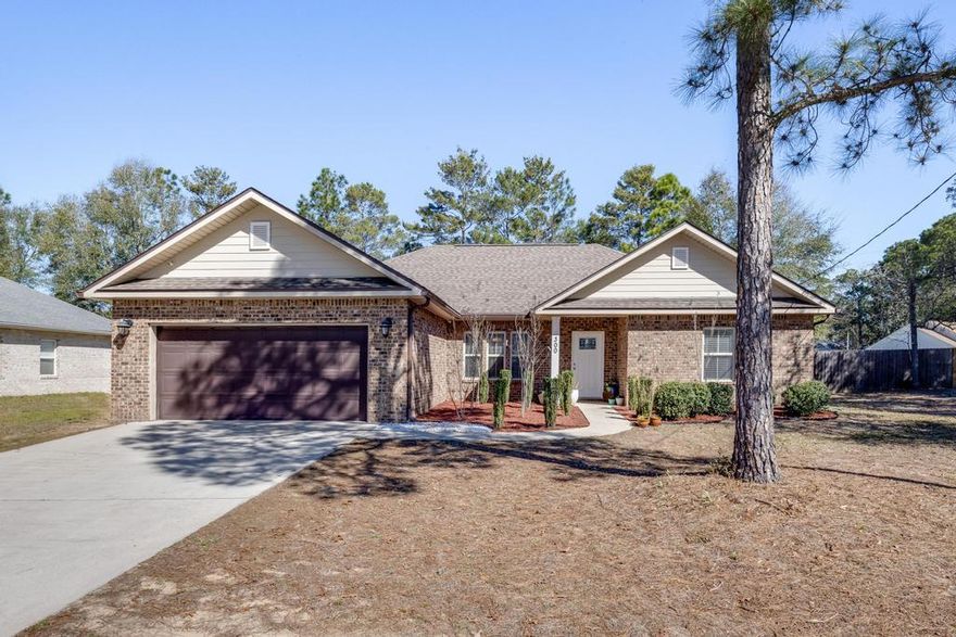 Modern charm meets classic craftsmanship at 300 Island Drive! This 4-bed, 2-bath all-brick beauty sits on a spacious corner lot just south of I-10. Step inside to soaring tray ceilings, crown molding, and an airy open layout designed for easy living. The chef's kitchen shines with granite countertops, stainless steel appliances, and 36' cabinets topped with crown. Porcelain tile adds a sleek touch throughout the main living spaces. Unwind on the covered lanai or retreat to the luxe primary suite with dual vanities, garden tub, and walk-in shower. Stylish, spacious, and move-in ready—come see it today!