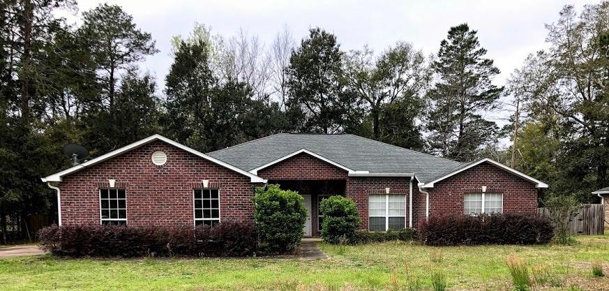 TRUSTEE SALE MUST SELL! Only 13miles from the beach.brick construction, side entry garage, formal dining room, family room PLUS living room, fireplace, French Doors leading to the Covered Back Porch, Large Master Suite and Master Bath that includes Garden Tub with whirlpool jets, double vanity sinks, separate shower and a privacy toilet area. Large additional bedrooms and Jack and Jill Bathroom with privacy door leading into toilet and bathtub area. Very nice large laundry area with closet. Needs new flooring and some TLC. As Is. All dimensions are to be verified by Buyer(s).