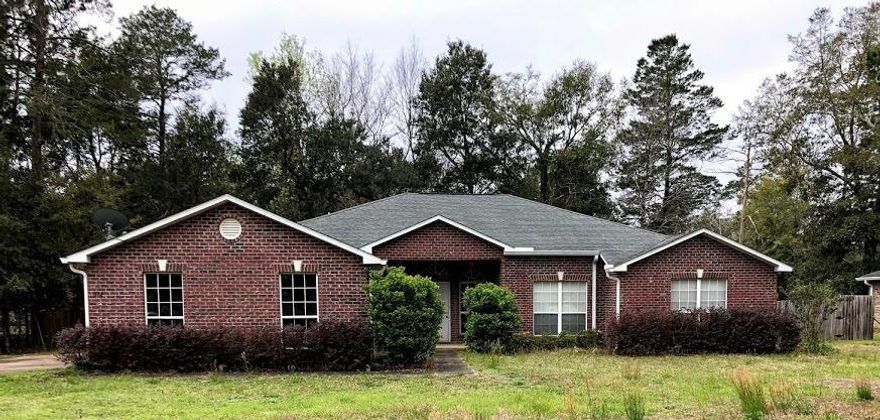 TRUSTEE SALE  MUST SELL! Only 13miles from the beach.brick construction, side entry garage, formal dining room, family room PLUS living room, fireplace, French Doors leading to the Covered Back Porch, Large Master Suite and Master Bath that includes Garden Tub with whirlpool jets, double vanity sinks, separate shower and a privacy toilet area. Large additional bedrooms and Jack and Jill Bathroom with privacy door leading into toilet and bathtub area. Very nice large laundry area with closet. Needs new flooring and some TLC. As Is. All dimensions are to be verified by Buyer(s).