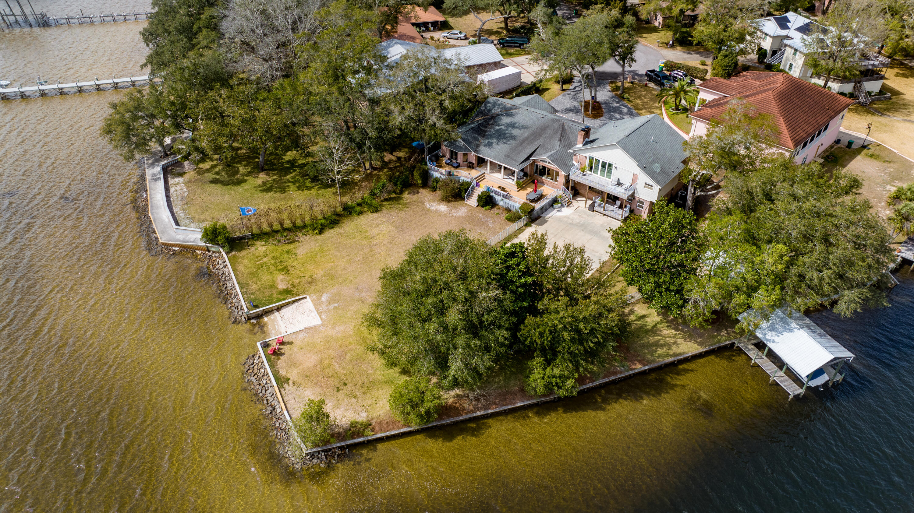 *Under Contract* But, you may put in a backup offer.  This 6 bedroom 4.5 bath waterfront home is sure to check all of your wish list boxes.  This incredible lot has 100' of waterfront on Rocky Bayou and 200' of waterfront on a protected canal.  The incredible views of Destin to the South are rivaled by the quaint canal views to the East. You really have the best of both worlds!   This home is located on a cul-de-sac with an expansive paver driveway as well as space to park a boat or boat trailer. This home has 2 Primary suites, (one on the main level and the other located on the 2nd level), two living room areas, a formal dining room, a great space for an office or formal sitting area (currently a playroom), a gym, and views that will make you never want to leave home!