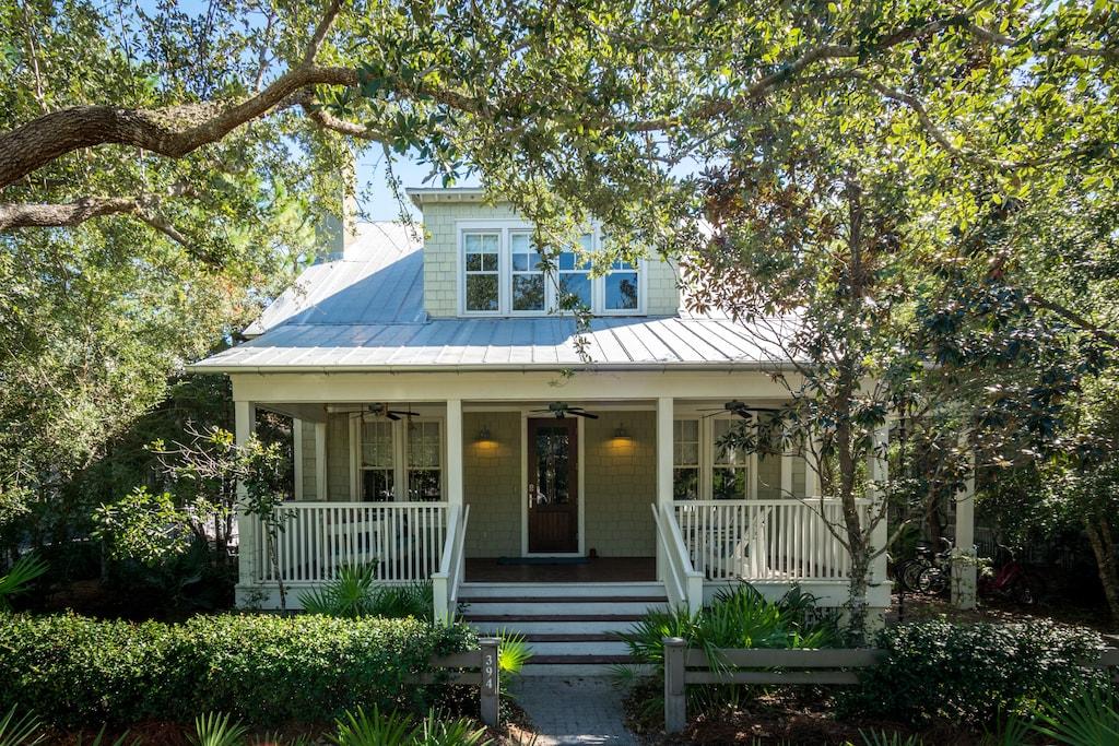Newly redecorated luxury home with bedroom on the main floor and ideally located by the new Camp Watercolor, tennis courts and the Seaside cut through path. This secluded home is on a large private lot backing up to nature preserve and offers peaceful green park views and is adjacent to the newly added Bocce Ball court. There are 3 professionally decorated bedrooms plus an extra sleeping room equipped with a twin bed and trundle. Interior features include beautiful Pine floors, Cedar beams, fireplace, Quartz counter tops, Jenn-Air appliances, travertine floors and more. Strong rental history with $120,535 in 2020  and sleeps 10 comfortably. This property also has expansion opportunities with the potential for a 5,000 plus square foot home with a pool. Sold Furnished.