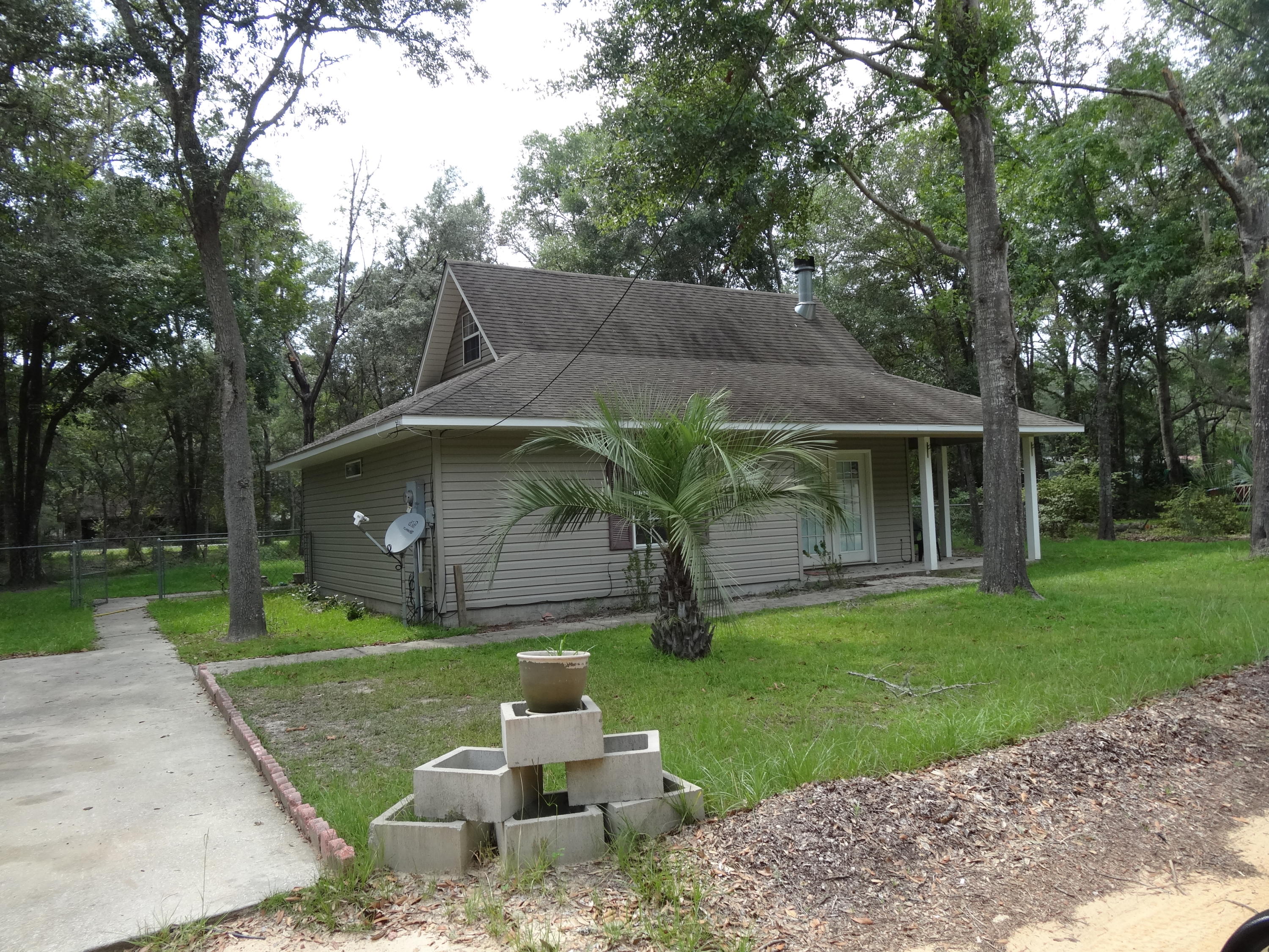 Quaint country cottage in quiet area near Black Creek Lodge. Just minutes away from the bay and beaches. The home has oak cabinets, acid stained concrete floors, stone fireplace, and loft. The open floor plan and soaring ceiling makes the space live large. Lovely lot with fenced back yard, landscaping, concrete parking area. New interior paint and contractor repairs have been made after last tenants. The utility shed conveys as is. In-wall 23,500 btu heating and cooling unit. A great second home or permanent residence.