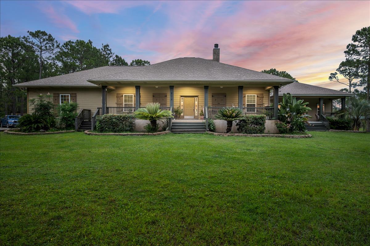 An Equestrian Estate in South Walton County just a short walk or horse back ride to the Choctawhatchee Bay, and 5 minute drive down Hwy 393 to the Famous White Sand Beaches of 30A. On this 10 acre estate sits a beautiful custom built home with carriage house. The main house has 2,369 Sq Ft, 4 bedrooms and 2 full baths with lvp and tile flooring throughout. The carriage house has an extra 676 Sq Ft 1 bed 1 full bath. The property also has a 5 stall shed row with tac room and feed room attached, 48' x 24' hay barn, 100' x 200' lit arena, and 2 large fenced in paddocks.