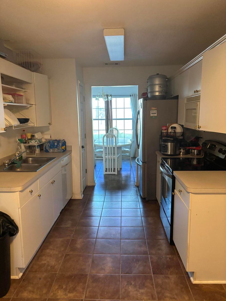 Nice location south of I-10 for commute to Eglin or FWB. Just off PJ Adams heading west, 2 min to hwy 85.  Metal roof, tile floor throughout, covered back areas can be improved/finished.  Beautiful landscaping in front, back yard could use some enhancement.  Eat in kitchen and dining room.  Washer and dryer stay with house along with refrigerator.  New screen door is planned prior to closing.