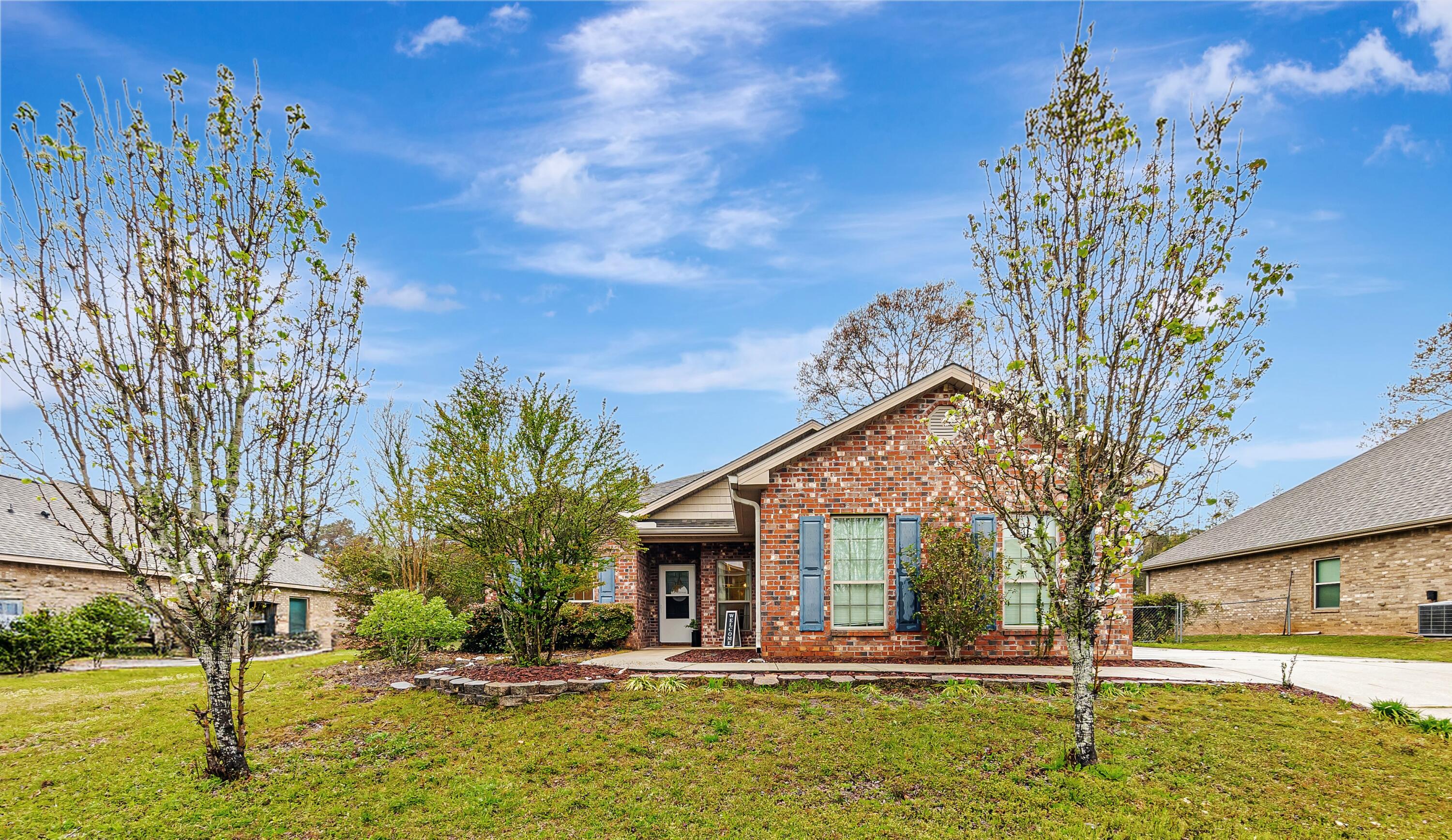 Welcome to this beautiful brick home in the desirable Autumn Woods community! This home offers a functional layout and plenty of potential. Step inside to find a spacious living room with a tray ceiling and sliding glass doors leading to the backyard. The kitchen features a cozy breakfast nook, while an additional flex space can serve as a dining room, office, or playroom tailored to your needs. The primary suite includes a tray ceiling, en-suite bathroom with dual vanities, a walk-in closet, a garden tub, and a separate shower. Two additional bedrooms and a full bath are located on the opposite side of the home, providing privacy for family or guests.Enjoy the outdoors from the screened-in patio, overlooking the fenced backyard--a great space for pets, play or entertaining. The side- entry 2-car garage adds curb appeal and convenience. Minutes from local schools, 7th Group, Duke, and Eglin--this home is ready for its next owner to make it their own! 