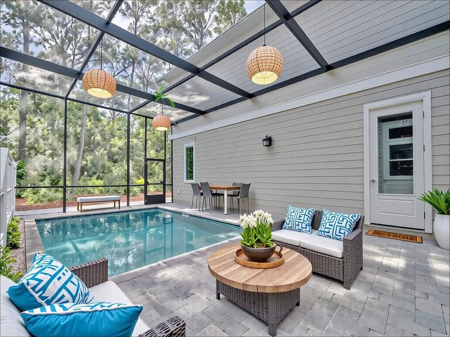 116 E George Street presents a newly constructed five bedroom residence in the heart of Point Washington, complete with a detached carriage house, private pool, and three car garage. Just moments from the Choctawhatchee Bay, this property offers a rare balance of privacy, flexibility, and long term value. With no HOA and no rental restrictions, it is equally suited for full time homeowners, second home buyers, or investors seeking true optionality. The main residence features three bedrooms and three and a half bathrooms, thoughtfully designed with the primary suite on the first floor. The open concept kitchen, living, and dining areas are anchored by a gas fireplace and an expansive island, creating a natural setting for both daily living and entertaining. A walk in butler's pantry with generous shelving and a beverage cooler adds both function and refinement. The first level also includes a laundry room and powder bath for convenience.

Upstairs, two guest suites each offer private bathrooms, complemented by an additional living area that provides separation and flexibility.

Positioned above the oversized garage, the carriage house includes a full kitchen, living area, two bedrooms, and a full bathroom, making it ideal for extended family, guests, or income producing potential. Between the main home and carriage house, the fully enclosed private pool creates a central courtyard setting designed for year round enjoyment.

Located just steps from the bay, a public boat ramp, and nearby nature trails, the setting encourages an active coastal lifestyle while remaining only a short drive from the beaches along 30A. This is a new construction opportunity that delivers space, versatility, and a peaceful Point Washington address without compromise.

Reach out directly for more details. 