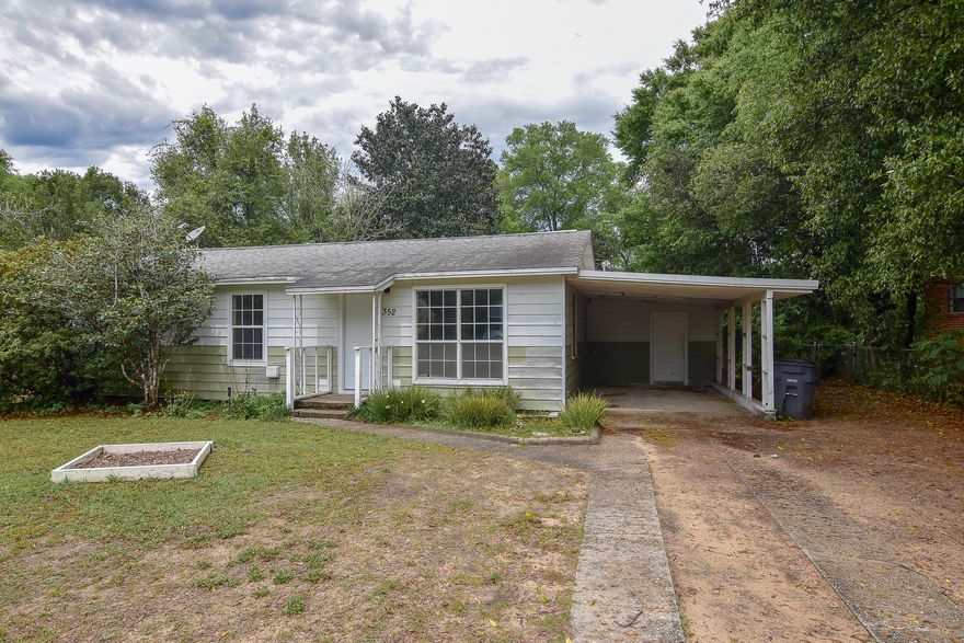 With a little TLC, this could be a great starter home or investment property! Adorable 3 bedroom, 1 bathroom ranch with attached carport is located on a large rectangular lot with mature trees and plenty of room to park a boat, trailer, or multiple cars. The fenced-in backyard has a large shed/workshop (conveys as-is) and is a great size with enough room to add a small pool. Home has newer A/C (4 years old), has been freshly painted, original hardwood floors and is move in ready.