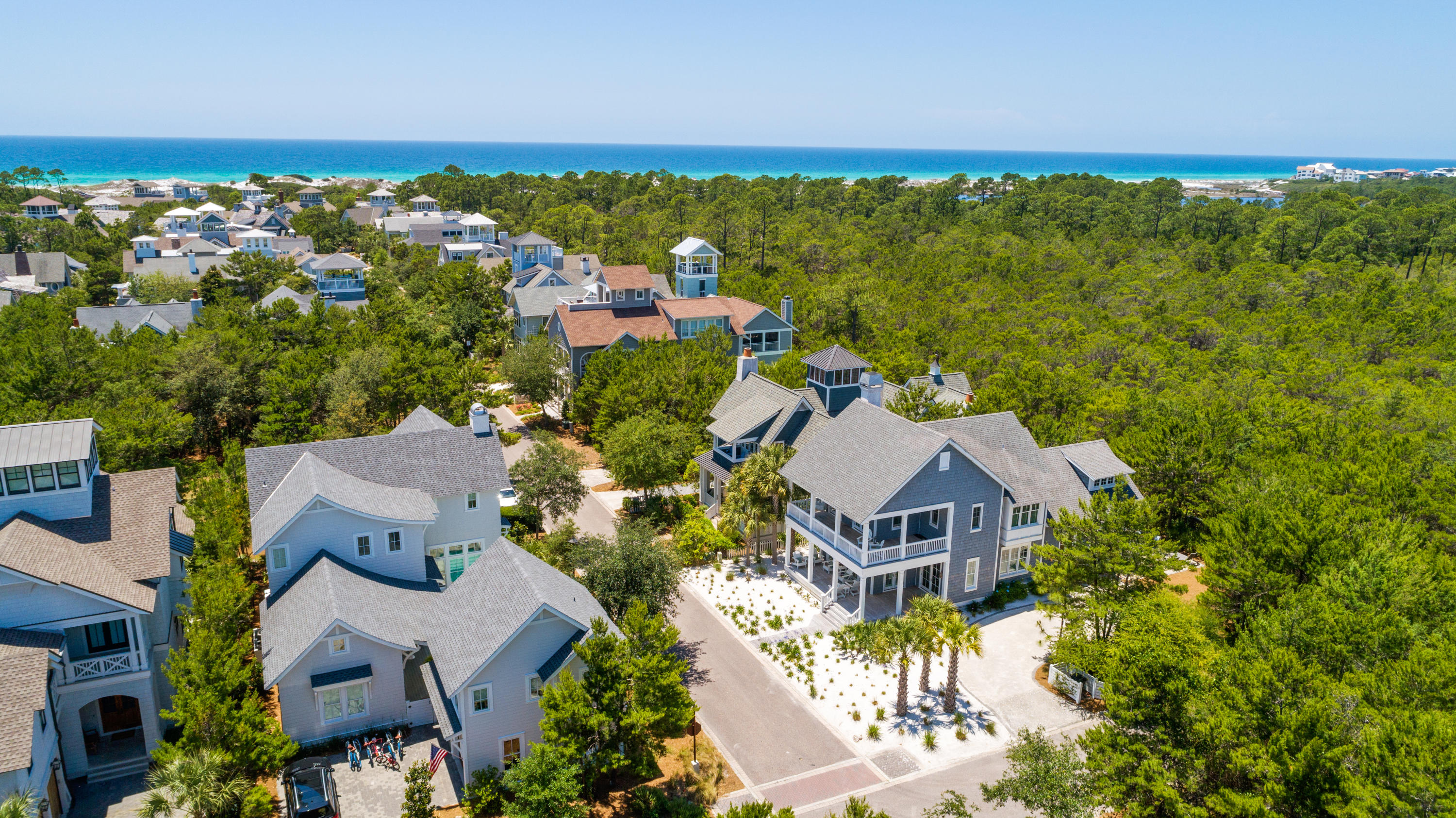 Amazing opportunity to own this unique 4 bedroom, 3 1/2 bath home in Watersound Beach! This immaculate beach home sits on a large corner lot & backs up to Deer Lake State Park, offering unparalleled privacy. This extra wide lot allows for the addition of carriage house, outdoor kitchen, pool and parking for up to 6 cars. Designed by Gerald Burwell of VIE Magazine and masterfully constructed by Dune Construction, this beautiful coastal residence is one of the most photographed homes in all of Watersound Beach. The white sand yard makes it unique to the community. Spacious wrap around porches welcome you into the entry foyer and the spacious, open concept living area. From there, the home gracefully flows into the cozy dining area and gourmet kitchen, which leads to the screened back porch.