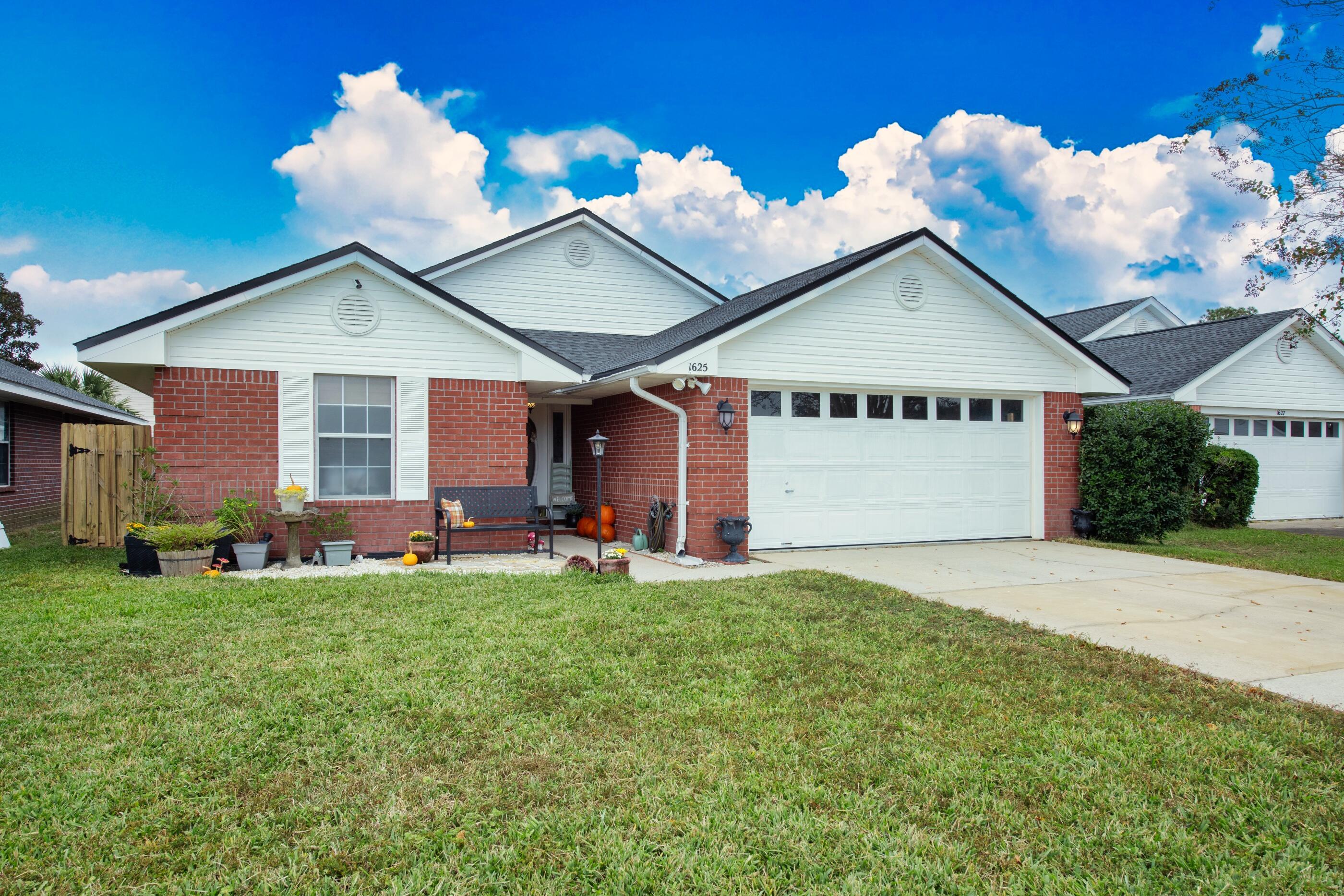 Welcome to this beautifully maintained home that combines comfort and style in a charming layout. Conveniently located less than a mile to Hurlburt Field and easy access to a variety of shopping options and more. This home features a split floor plan, offering privacy and space. Open kitchen, which boasts ample cabinet space. Maser bedroom with walk in closet. The master bathroom is a standout, complete with a relaxing garden tub, separate shower and double vanity. Enjoy the spacious dining and living areas, enhanced by vaulted ceilings that create an inviting atmosphere.  French doors that lead to a pleasant backyard perfect for gardening and outdoor gatherings. New roof installed in 2020, water heater replace in 2022 and HVAC 2015.