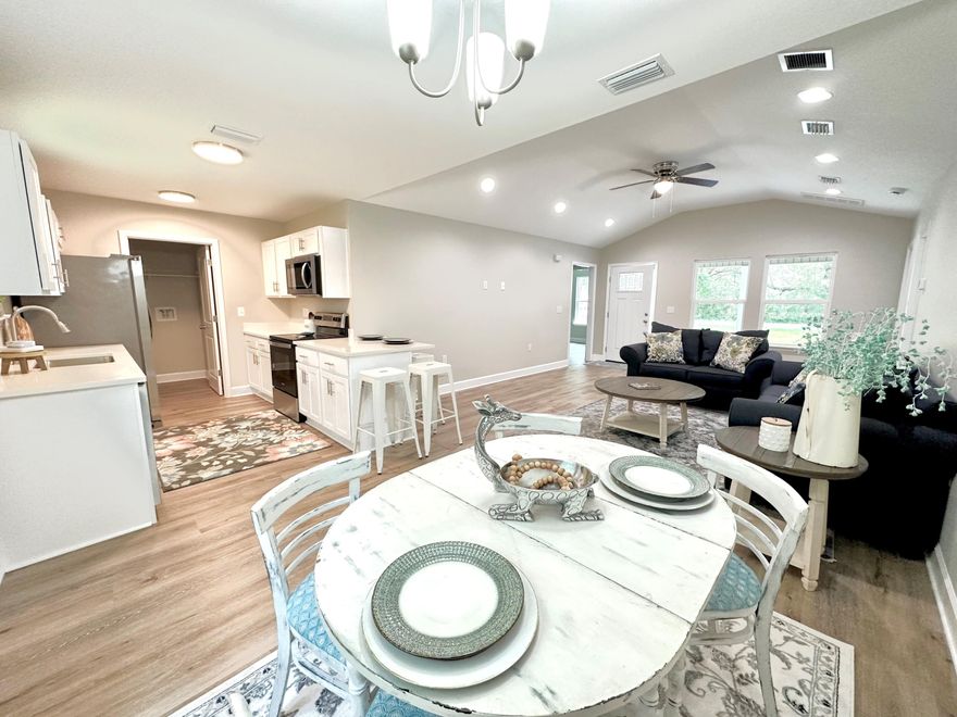 $5,000 credit to the buyer to use anyway you'd like!!This newly constructed residence exudes an irresistible charm, with its captivating front porch providing an ideal spot for relaxation and leisure.  Offering three bedrooms, two bathrooms, and a one-car garage, this home is both practical and inviting. Conveniently located just off Highway 90 West, this property provides easy access to shopping and a variety of amenities. Inside, the home boasts elegant features, including luxury vinyl plank flooring that spans the entire space. The kitchen is adorned with sleek white shaker cabinets, stainless steel appliances, and granite countertops, creating a modern and sophisticated atmosphere. Take time to see this one today!