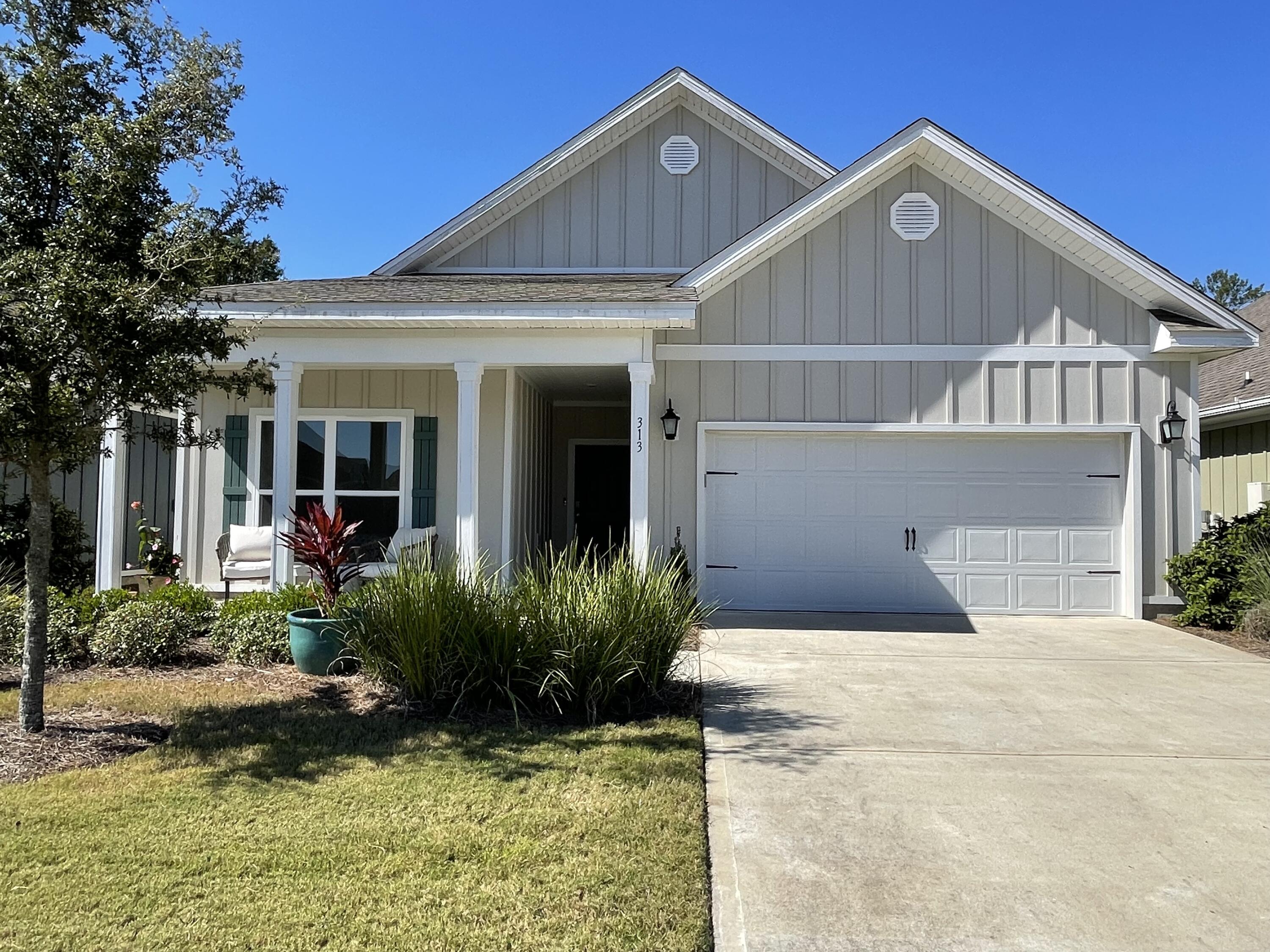 Marvelous 3bed/2ba home, 1568 Sq. Ft. Craftsman Style 2020 home located in the lovely Gated Firefly neighborhood of Hammock Bay. Sellers are offering $5,000 towards the buyers' closing costs!!A must-see! From the moment you walk into this exquisite home, it welcomes you with a warm and comfortable living space for the whole family!! This amazing home features open concept kitchen (all stainless appliances), dining and living areas, elegant 9' ceilings, crown molding, Engineered Vinyl Plank (EVP) flooring throughout the common areas, carpet in all bedrooms. There are lots of windows throughout offering lots of natural lighting.  The primary bedroom is very spacious with ample room for your bedroom furnishings. The lovely primary bathroom features a double vanity, walk-in tiled shower,