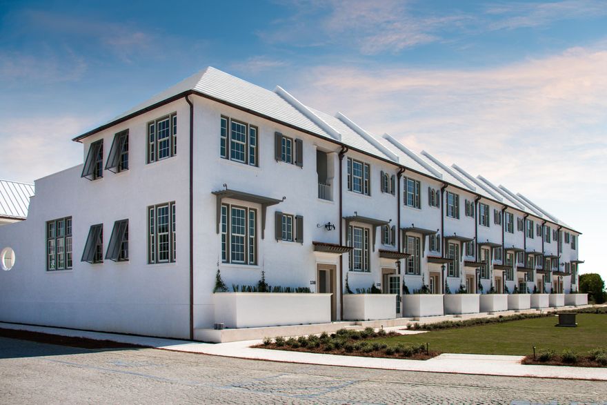Forming a welcoming addition to the breathtaking Caliza Pool location, Caliza Courts are the newest completed homes in Alys Beach. Designed by Khoury Vogt Architecture, the rowhomes are embellished by an attached park along Somerset Street and feature raised stoop entries bordered by landscaped planters. Brilliant design details have been woven into these centrally located rowhomes. The light filled great room spans the width of the homesite and boasts 16-foot ceilings, 12-foot tall French doors, and windows that open to a private courtyard which includes a pool and guest suite. Additionally, the great room features the reflective Venetian plaster finish on the walls and ceiling. The spacious kitchen offers all the finest selections in appliances, cabinetry, countertops and tile accented walls. The second & third bedrooms both feature private baths and occupy the second level, maximizing privacy. The Master suite which features ample natural light and a private master bath with a double vanity stone vessel sinks and Dominican Shellstone surround tile. 

The inviting courtyard is accentuated by a serene, dipping pool (heated) and fountain, as well as Dominican Shellstone paving and easy to maintain espalier landscaping. Across the courtyard, a covered, open-air loggia fronts a much desired private guest suite (fourth bedroom) above a two-car garage. The detached guest suite can be rented separately when the main home is unoccupied. Furthermore, the main home may also be rented as a three bedroom, when the private detached guest suite is unavailable. This home is an absolute must see with its soothing beach palette and spacious layout.
 
