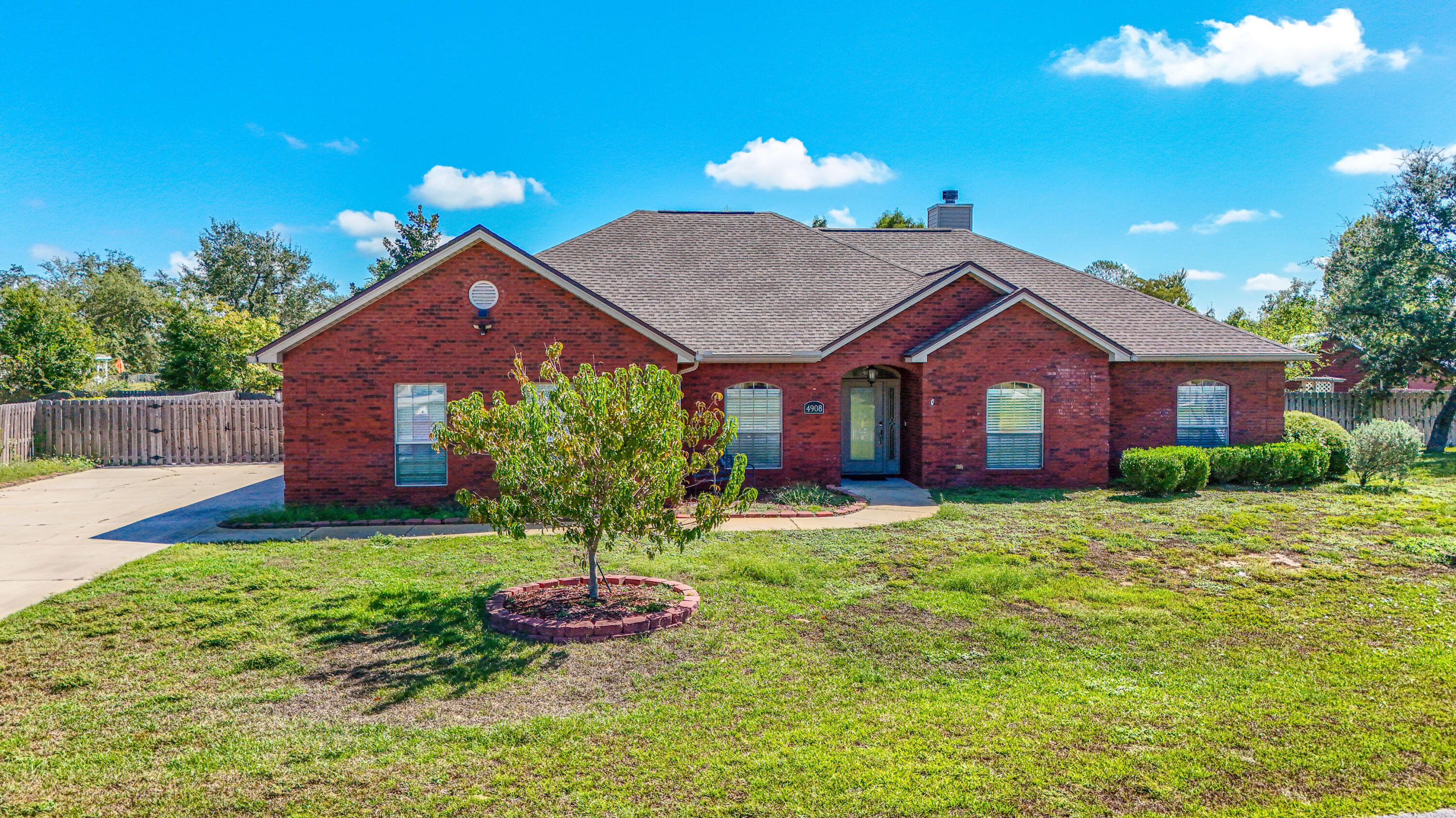 Looking for space, comfort, and convenience? This spacious 4-bedroom, 2-bath brick home has it all, sitting on nearly 0.5 acres that offers both privacy and convenience. Situated in a quiet area yet just minutes from the new Publix and all the shopping, dining, and entertainment along 23rd Street, it's the perfect mix of peaceful living & easy access to everything you need! Inside, you'll find wood flooring, an open living and dining area, and a spacious master suite with a large bathroom including dual vanities. The updated kitchen features upgraded finishes, plenty of cabinet space, and a cozy breakfast nook. There is also a flexible bonus room that would make a great playroom or home office! (CONT IN ADD. REMARKS) Additionally there are three bedrooms and a large full bathroom, perfect for guests or family! The home also includes a laundry room, two extra storage closets, and an oversized two-car garage with a utility area and extra parking in the large driveway. Step outside to a fenced backyard with a 12x16 storage shed and a screen porch, perfect for relaxing or entertaining. Highpoint Park is just 3 minutes away with a playground, small boat ramp, dock & kayak launch! Did we mention the emerald waters of Panama City Beach are only 30 minutes from your door?! Come see this hidden gem and make it your new home!