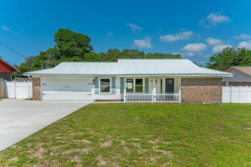 This completely renovated 3/2, 1,706 sf ranch style home is absolutely charming.  With all new luxury vinyl plank flooring, all new fixtures and finishes throughout, this home is 100% turn key.  The open living room and kitchen makes this the perfect place to entertain with a spacious breakfast bar, all new stainless steal appliances, brand new quartz countertops, real wood cabinets, soft close drawers, a modern subway tile backsplash and a deep farmhouse sink.  Just off the kitchen is a newly refinished brick fireplace and custom wood mantel to match the natural wood ceiling beam which captures your eye the moment you walk in.