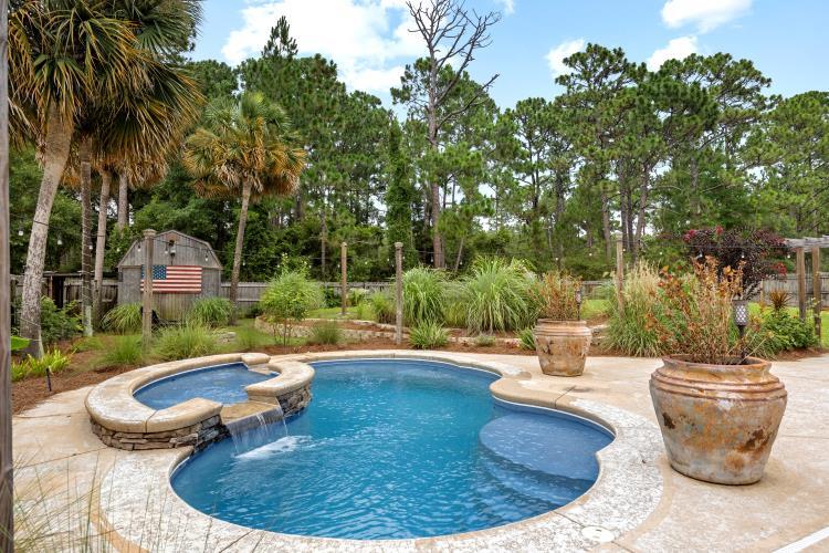 Charming all brick pool home with climate controlled sunroom and office in one of Navarre's most desirable neighborhoods; Holley by the Sea. This updated and freshly painted property comes with a new roof at closing. Kitchen has stainless steel appliances, granite, large island and wet bar with wine frig. Master bedroom is large enough to put a sitting area, fitness equipment or both! Master bath is newly remodeled with a large walk in shower, stand alone tub, and double granite sinks. Master closet has custom built ins. Utility room with half bath convenient for swimmers enjoying the saltwater pool. With all the amenities, recreation center, and water access in Holley by the Sea; open floor plan and tasteful built ins you will immediately see the value in this spacious home.