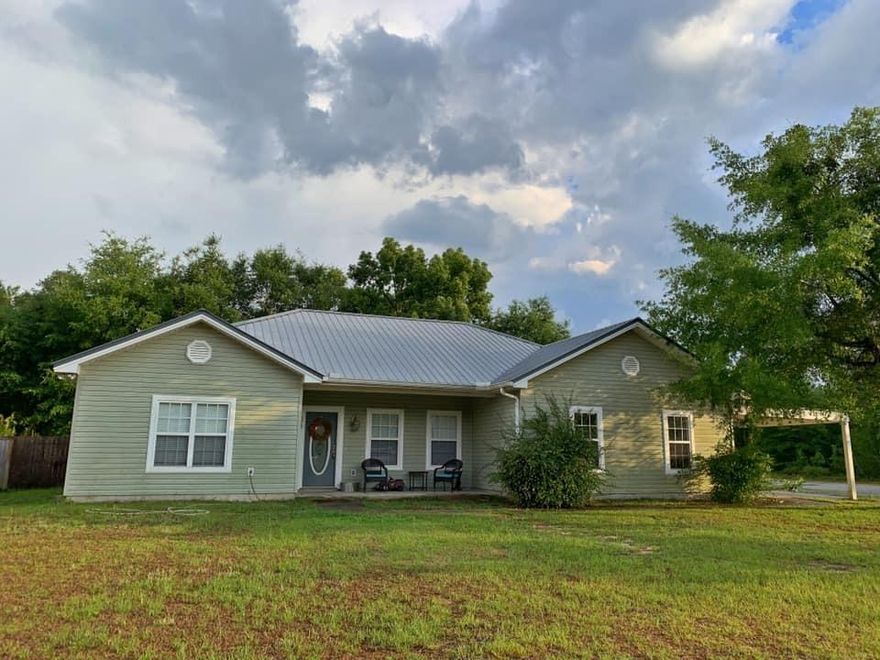Four bedroom, two bathroom, one story home in exceptional condition with a huge fenced-in back yard! This property includes two lots and has road frontage on three sides. This home has convenience in mind with the open floor plan putting the kitchen, dining & living room all together. Split bedrooms has the three additional bedrooms (each with it's own walk-in closet) and full bath (with double sinks) on one side of the home and the master suite on the opposite. The kitchen is spacious with plenty of cabinet and counter top space, plus an island and two pantries. The back yard has entertaining in mind with the covered patio and tree house ready! The second lot has a well, septic and city water already in place! Call to make this your home today!