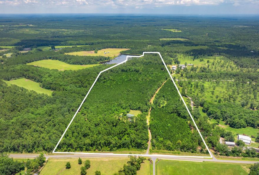 691 E Indian Creek Ranch | DeFuniak Springs, FL.  Just 25 minutes from the Gulf and the sugar-white beaches of 30A, this 80-acre retreat offers an extraordinary blend of rugged charm and refined possibility. Indian Creek Ranch invites you to experience the best of Florida's backcountry beauty, with a location that delivers privacy, adventure, and accessibility.Surrounded by expansive neighboring parcels--approximately 225 acres to the north and 350 acres to the south--this gated property offers unparalleled seclusion. Nestled atop the highest point along Indian Creek Road, it provides sweeping views and tranquil surroundings. The land is thoughtfully cultivated with five established hunting food plots, multiple shooting blinds, and a private rifle range. A haven for outdoor enthusiasts, the property is abundant with deer and turkey populations and so much more!

Included in the sale are a fifth-wheel RV, a riding mower, two additional RV sites (one with 50-amp hookups), and covered storage for golf carts, ATVs, and trailers. A utility buildingcurrently used as a garageoffers flexible workspace or storage. A fire pit area provides the perfect setting for evening relaxation under the stars.

Positioned just six miles from the historic lakeyard and charming downtown DeFuniak Springs, you'll find yourself minutes from a true Hallmark-style village. The property is also just five miles from I-10 and nine miles from the municipal airport, making it easily accessible from Birmingham, Atlanta, Nashville, and the surrounding beach communities.

This versatile parcel is ideal as a private homestead, corporate retreat, or long-term investment. It carries potential for subdivision into eight- to ten-acre homesites, pending approval, and the seller is open to negotiating a 20-acre carve-out. For buyers purchasing the full 80-acre parcel, the seller would require several months to vacate the 20-acre section.

Indian Creek Ranch is more than landit's lifestyle, legacy, and limitless opportunity in the heart of Northwest Florida.