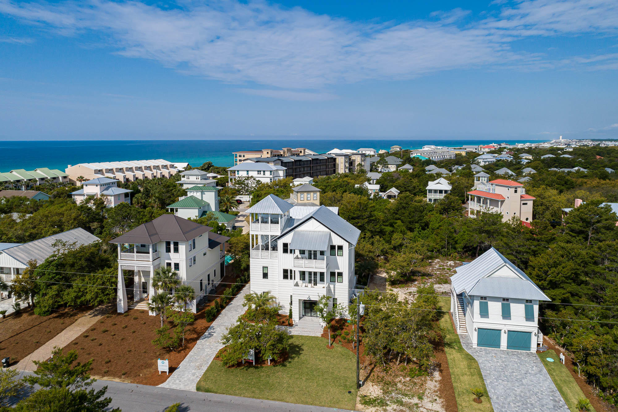 Introducing a brand new, luxury custom residence, poised in a prime location, on the east end of Scenic Highway 30A. This beach home conveys fully furnished, with high-end sleek interiors appointed 30A Design Group. Boasting a uniquely large site with an impressive pool deck and outdoor space for enjoying the coastal lifestyle. With strong annual rental revenue projected at +$250K, the spacious floor plan, with 5 bedrooms plus a bunk room, and an additional carriage house with upper loft, is ideal for large family beach gatherings or for maximizing a strong return on investment, as a vacation rental home. With two large master suites, it is ideal for multiple families to rent together. A short to the beach access,