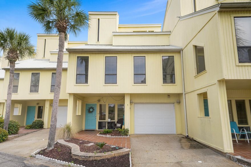 Rare 4 BR with water views, easy beach access, 22' boat slip and 2 car garage! This unique townhome on Navarre Beach features over 2200 sq ft with a great floor plan and solid rental history. Walk to the beach in less than 3 mins or take a 30 second golf cart ride to one of Florida's most beautiful beaches. Property is offered fully furnished and is will be move in ready upon close. This property offers high ceilings in the main living area, 4 spacious bedrooms and 2 Full baths. The entry level boasts an open foyer that leads to a bunk room with outdoor patio. The 2nd floor opens to a large living/ kitchen/dining area with plenty of space for all to gather. The 3rd floor features the large master suite with ensuite bath to include jacuzzi tub and glass shower. This one won't last long!!