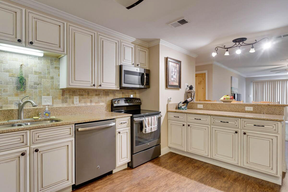 Welcome to one of Destin's most coveted communities on Holiday Isle! This gated waterfront property offers the ultimate coastal lifestyle with a private sandy beach, sparkling pool, and a beautiful clubhouse featuring a full kitchen and fitness room. This stunning condo includes access to a private boat launch and the rare option of a $500-per-year boat slip on Destin Harbor. Enjoy resort-style living just minutes from world-class dining, shopping, and the Emerald Coast's famous sugar-white beaches. A rare opportunity to own in the heart of Destin don't miss it!Buyer to verify any and all information deemed important to them.