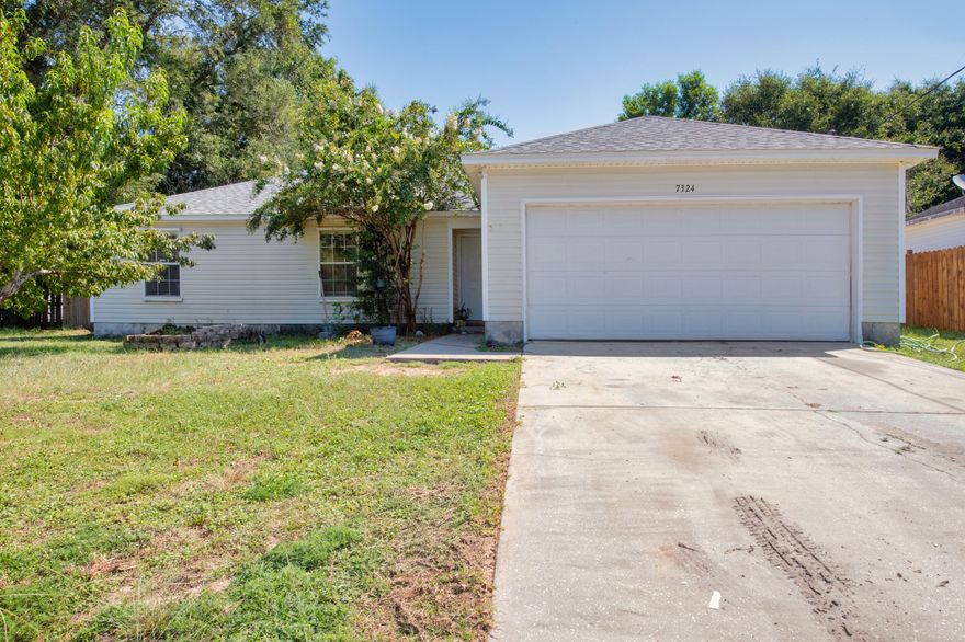 Located in the heart of Navarre this home offers beautiful spacing! As one enters through the front door, a coat closet on the left, a grand living area opens through, and dining space continues which connects to kitchen. Well sized bedrooms follow, to include primary bedroom with on suite bathroom featuring tub/shower combo, and well sized walk-in closet! Additional bathroom also features a tub/shower combo. The home features tile flooring throughout! The backyard is extremely large, fully fenced, and perfect to create an oasis! Finish through a great sized two car garage! This home has had major items replaced which include, septic in 2018, AC in 2017, and roofing 2021. Easy show, schedule a showing today!