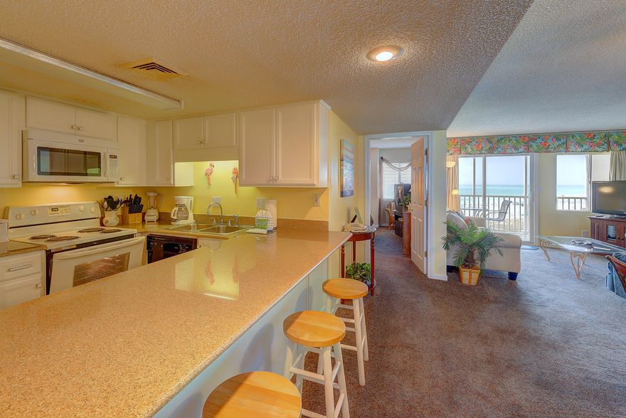 Casual beach condo located in the Holiday Surf and Racquet Club on Holiday Isle in Destin, FL. Private gated condominium with numerous amenities. Great 2 bedroom 2 bathroom condo with a private balcony overlooking the crystal clear emerald waters of the gulf. Bright a airy color palate makes this beach condo feel open and spacious. Located close to many of the areas main attractions such as the Water and Adventure Park, several casual and fine dining eateries, surf shops, grocery stores and much more. Family friendly condo perfect for making many lifetime memories come true.