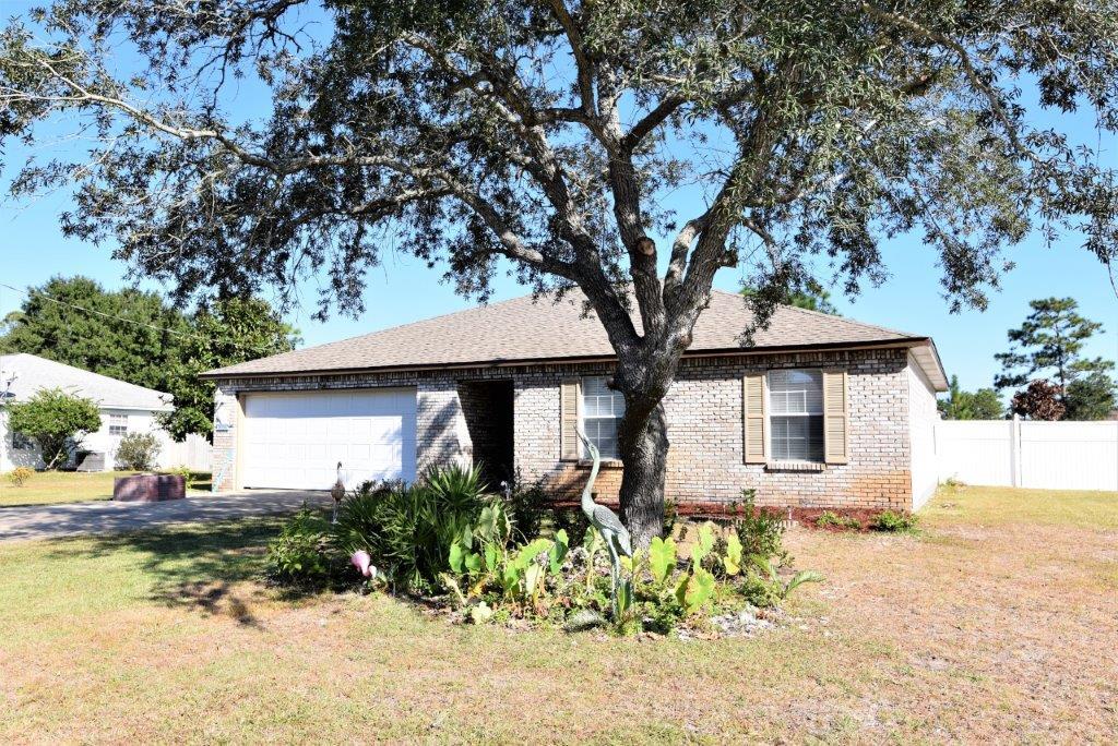 A nicely updated 3 bedroom home in Holley by the Sea. Don't be fooled by the square footage - No Space Wasted! Large fenced in lot, Granite Kitchen Counters with tiled backsplash and Stainless Steel Appliances, Updated Guest Bathroom with Granite and Tile, A/C (2011), 9' ceilings, laminate flooring and tile, large inside pantry and washer/dryer area, Master bedroom has walk-in closet and the garage will accommodate larger vehicles. Close to Hurlburt AFB, beaches and shopping. Holley by the Sea has a great recreation facility offering: Pool, Tennis, Playground, Clubhouse, Exercise and more.