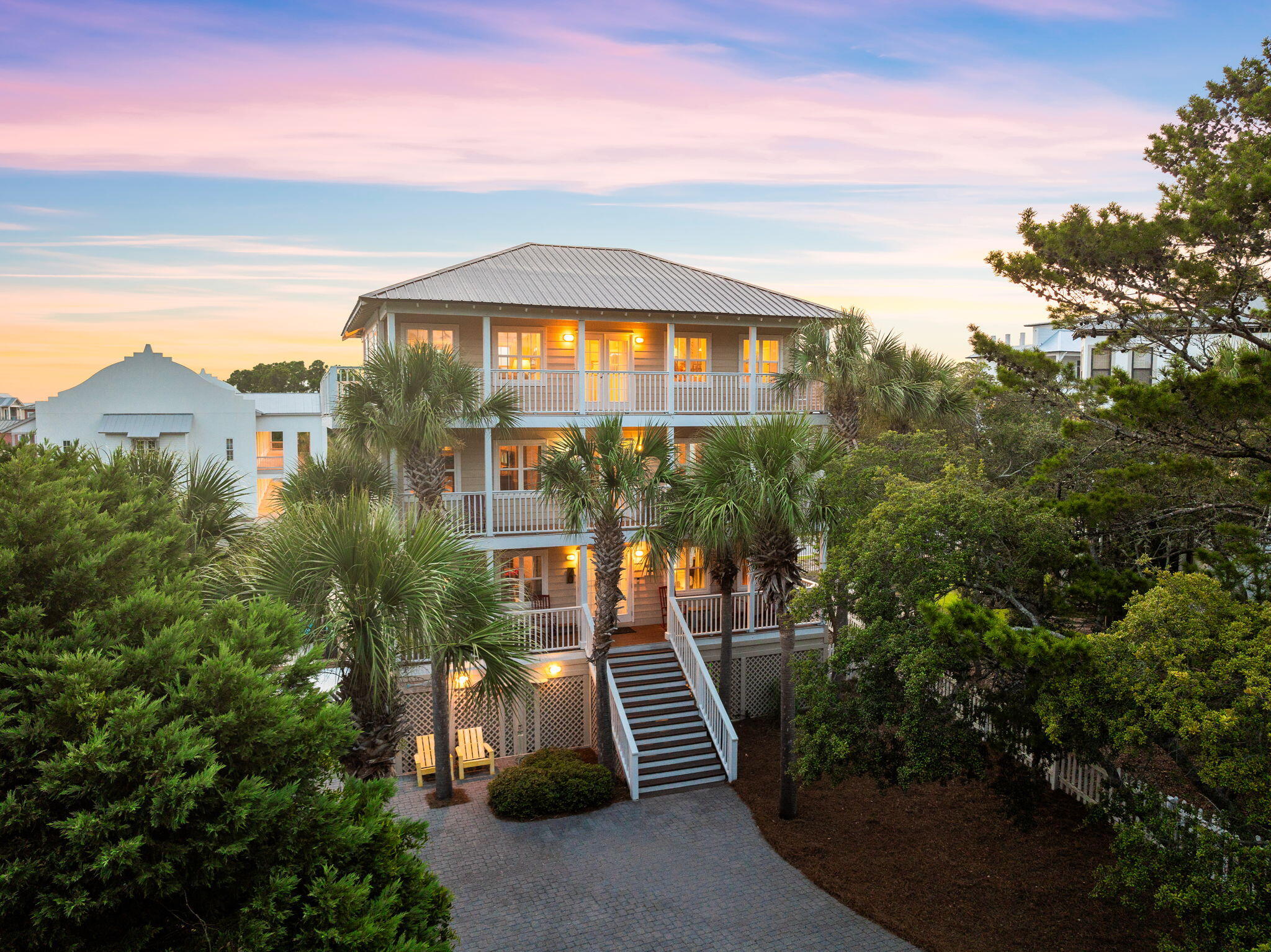 Experience coastal living with this extraordinary home in Dune Allen, where value and versatility come together in a way that few properties can offer. This remarkable 4-bedroom residence features stunning views of the Gulf and Oyster Lake from multiple levels and situated on one of the largest lots in the prestigious, gated Calypso Pointe community--the only home here with its own private pool. Step inside this three-story beauty, where three of the four bedrooms are generously proportioned to fit king-size beds with dual primary suites. The main living area is flooded with natural light and offers an open layout that flows to a wraparound balcony, ideal for enjoying the breathtaking views. The kitchen is complete with granite countertops, stainless steel appliances, and a breakfast bar. As you prepare meals, the serene waters of Oyster Lake provide a calming backdrop through the kitchen window. Throughout the entire home, there are Tile and LVP floors and recent upgrades include a new metal roof, upgraded electrical with a Tesla charger and enough amps for a future carriage house, and a new hot water heater.

With over 1,100 square feet of decks and porch space, the outdoor living options are endlesswhether it's lounging on a porch swing, enjoying a quiet moment on private seating, or marveling at the stunning Gulf views from your balcony.

The outdoor space is truly unparalleled, featuring a fenced-in backyard with a rare 30A lawn, a private pool with a new gas heater, and a ground-level deck ideal for sunbathing. Imagine movie nights under the stars with the projector screen, or entertaining guests at the full private bar located underneath the house. This versatile area also serves as the ultimate hangout spot, complete with extra storage, a wood shop, and dedicated space for kayaks and paddle boards.

Located within the gated community of Calypso Pointe, this home offers not just privacy and security, but also access to community amenities such as a pool, green spaces, tree-lined streets, and ample guest parking. Plus, you're just a stone's throw away from Gulf Place, where the vibrant local scene comes alive with original art, mouthwatering cuisine, live music, and a laid-back atmosphere.