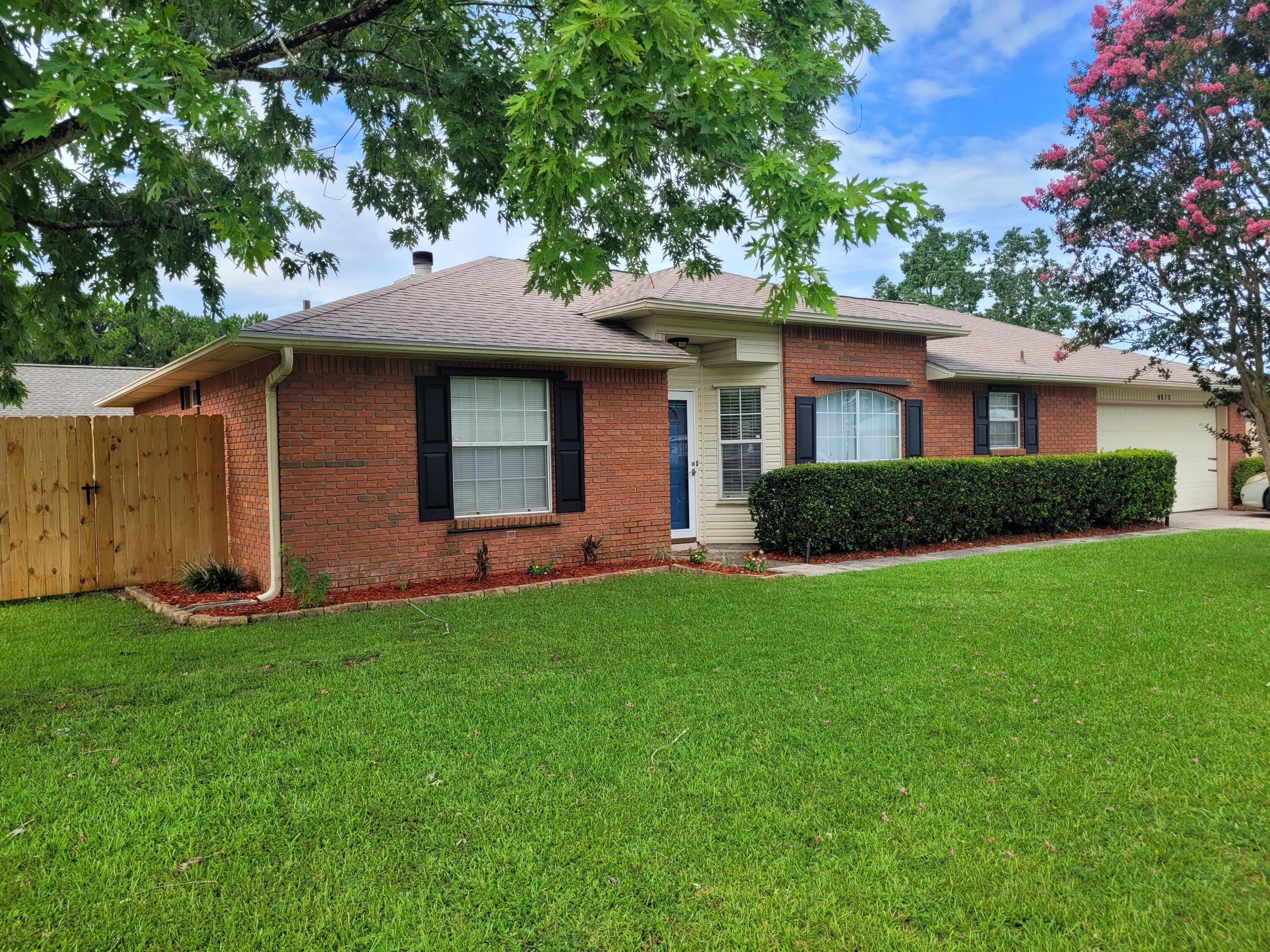 This all-brick home is 8 miles west of Hurlburt and 3.5 miles east of Navarre Beach bridge. The large master bedroom features a walk-in closet and a master bath with cultured marble double vanities and a tile floor. The open kitchen boasts Corian countertops, a seamless sink, plenty of wood cabinets, a pantry, and a Corian-topped island. Stained oak cabinets adorn the kitchen and bathrooms. The formal dining room adjoins the kitchen and overlooks the great room with a vaulted ceiling and brick fireplace. Large corner lot wih fenced yard and firepit. Easy access for a large boat or storage in the backyard. One year lease, no pets, no smoking, clean credit (minimum 700 FICO credit score) good and verifiable rental and employment history. Rent reflects discount if paid by first of each mth