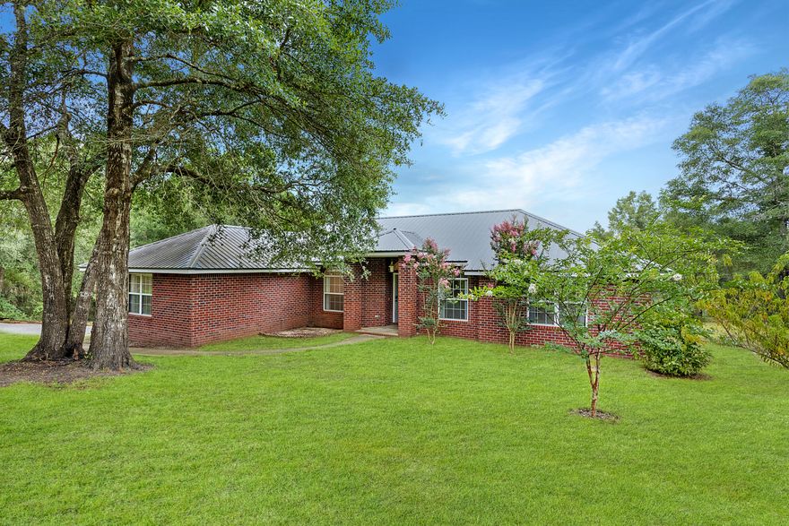 Come take a look at this beautiful 3 bedroom 2 bathroom home sitting on almost 4 acres of land! Upgraded counter tops, all stainless appliances along with tile and wood floor throughout the home. Huge back deck over looking the water.