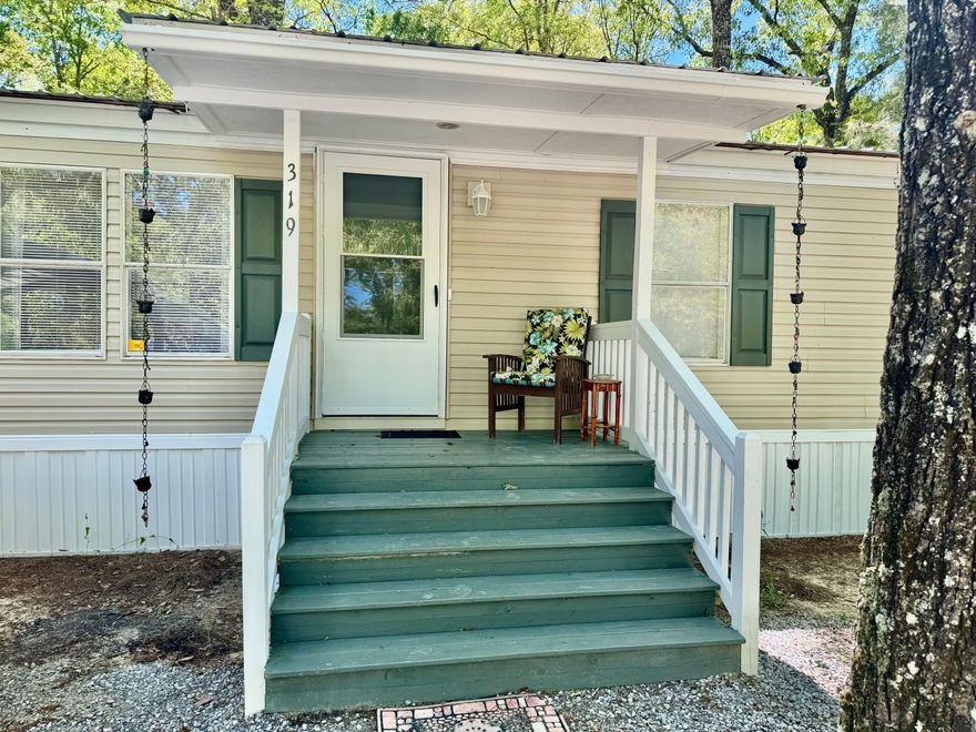 Escape to this idyllic retreat nestled in a serene wooded lot, just minutes away from the white, sandy beaches of the Emerald Coast. This beautiful property offers the perfect blend of tranquility and convenience, boasting a well-maintained fence for added privacy and security.  Step into a cozy and inviting interior, tastefully furnished for comfort and convenience.  Spend your days basking in the sun and surf, as the beach is just 30 minutes drive away.  Whether you're seeking a weekend getaway or a permanent residence, this charming home offers a perfect retreat from the hustle and bustle of city life.  Don't miss out on this rare opportunity to own a slice of paradise! Schedule a viewing today and experience the beauty and serenity this property has to offer.Zoning is Rural Village