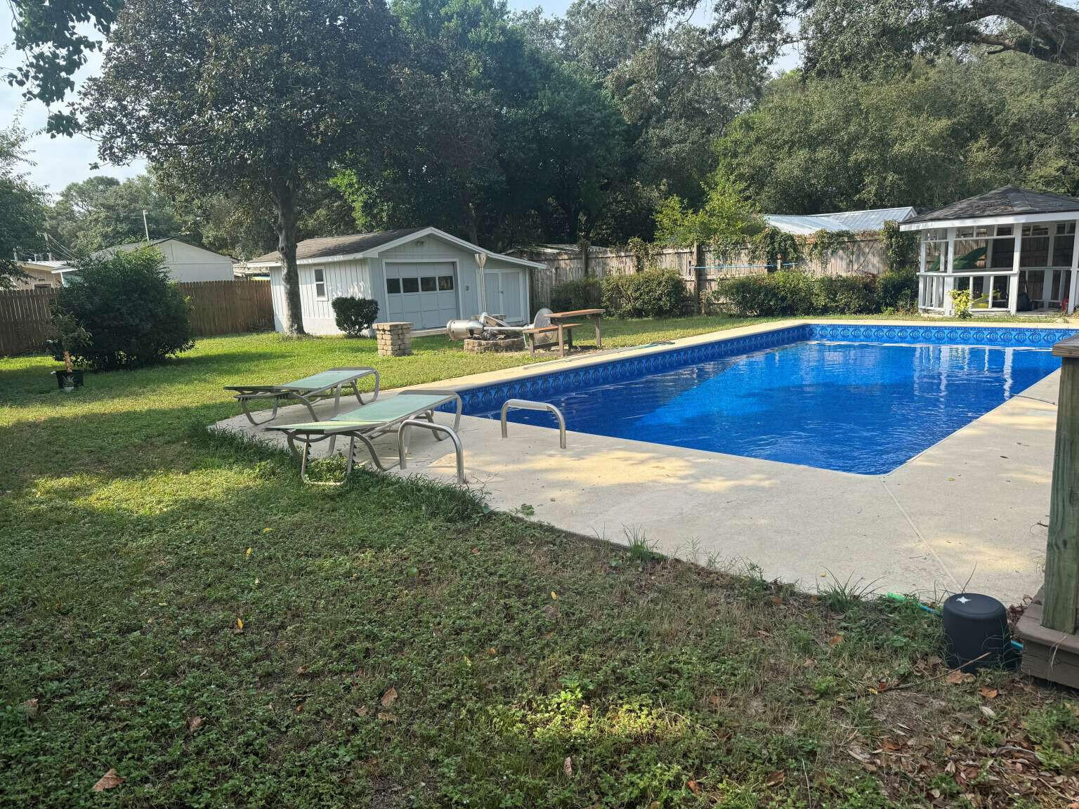 Fun in the sun is right outside your back door with this beautiful pool which has a brand new liner! Entertaining will be a delight with your firepit, for cool evenings to make smores! Need a little shade? The cozy gazebo and covered back patio are just perfect for that. And, who wouldn't be excited to have a bathroom in every bedroom which is unique for each person? The flooring throughout the home is vinyl plank so allergies won't be an issue and clean up will be simple. The heart of the home is centered around the gorgeous, renovated kitchen. What is not to love about shaker white cabinets, granite counter tops, a farm sink, stainless steel appliances, tiled back splash and undermount lighting that changes color? Additionally, there is a bar sink and storage area by the refrigerator. Charming ambiance can be created with your electric fireplace in the living room that is beautifully surrounded with granite. You will also love the tongue and groove ceiling with exposed beams. The primary bedroom is off the living room with access to the covered back porch. You will adore the ensuite when you need time to relax and get away, even if it is just at home. The back yard has a privacy fence and gate to the left side. The storage/workshop is perfect for storing your gardening and lawn tools. This home is immaculate. See you soon! Investors: 4 leases in place: $1370/$1250/$1195/$1145 $4960/month. Turn key investment property if desired.