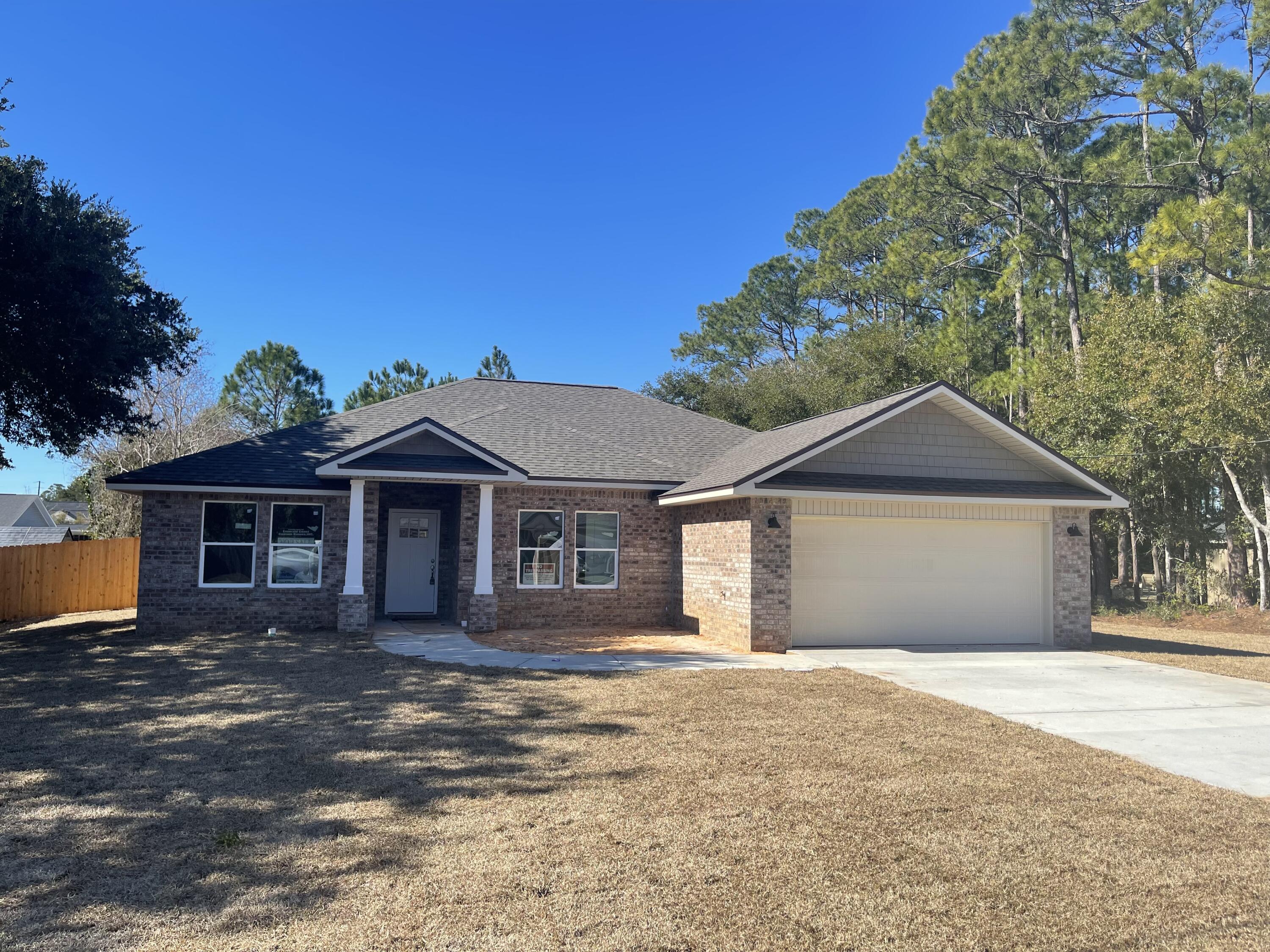 BRAND NEW ALL BRICK COTTAGE STYLE HOME IN PEACEFUL SETTING ON LARGE LOT. STATELY COLUMNS WELCOME YOU ON A COVERED FRONT PORCH. NO HOA! PLENTY OF ROOM FOR FUTURE POOL OR WORK SHED! FEATURES:KITCHEN: Quartz counters, White shaker style wall cabinets & large complimenting accent Gray bar cabinet w/3 pendant lights, soft close drawers, SS appliances. Spacious pantry. LIVING ROOM: Airy & open to kitchen with recessed ceiling, crown molding, LED puck lights & Ceiling fan.MASTER BATH: Quartz counters, dual sinks, Lg beautiful custom tiled shower w/seamless glass door, Dbl shelved walk-in closet. MASTER BR: Tray ceilings, crown, puck LED lights, ceiling fan. PLUS: PREMIUM Vinyl wood plank floors. 12x24 tile in baths. Office/Bedroom LVP flooring, 3 Additional Bedrooms carpet. Covered