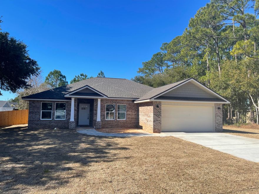 BRAND NEW ALL BRICK COTTAGE STYLE HOME IN PEACEFUL SETTING ON LARGE LOT. STATELY COLUMNS WELCOME YOU ON A COVERED FRONT PORCH. NO HOA! PLENTY OF ROOM FOR FUTURE POOL OR WORK SHED! FEATURES:KITCHEN: Quartz counters, White shaker style wall cabinets & large complimenting accent Gray bar cabinet w/3 pendant lights, soft close drawers, SS appliances. Spacious pantry. LIVING ROOM: Airy & open to kitchen with recessed ceiling, crown molding, LED puck lights & Ceiling fan.MASTER BATH: Quartz counters, dual sinks, Lg beautiful custom tiled shower w/seamless glass door, Dbl shelved walk-in closet. MASTER BR: Tray ceilings, crown, puck LED lights, ceiling fan. PLUS: PREMIUM Vinyl wood plank floors. 12x24 tile in baths. Office/Bedroom LVP flooring, 3 Additional Bedrooms carpet. Covered