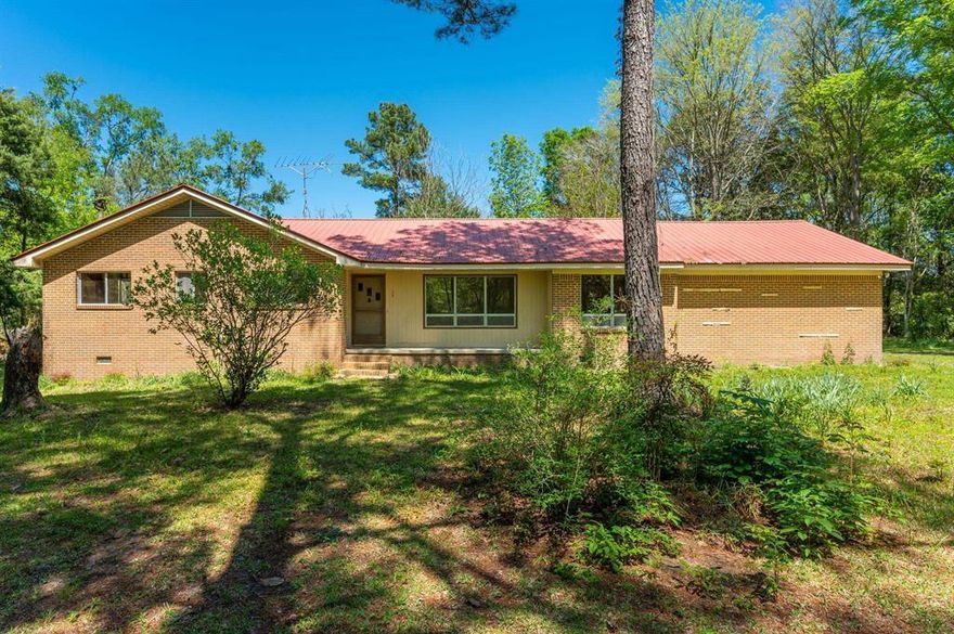 OWNER FINANCING - Secluded brick home on 11+ acres with 3 ponds. Located just out of Florala with easy access to Andalusia and Crestview along with Eglin AFB, this property offers three amazing pond that abounds with wildlife, along with tons of flowering shrubs! Tons of privacy welcomes you with a wooded canopy drive to home. Home offers 3 bedrooms, 2 full baths, a large laundry, formal dining, living room with fireplace, as well as family room. Property also offers a large barn as well as a covered enclosed in ground pool with a bathroom and a workshop. All the must boxes are checked with this property! Sellers have made major improvements to home to include new sheetrock, all new flooring, and new HVAC system. Home is sold as-is, seller will make no further repairs.