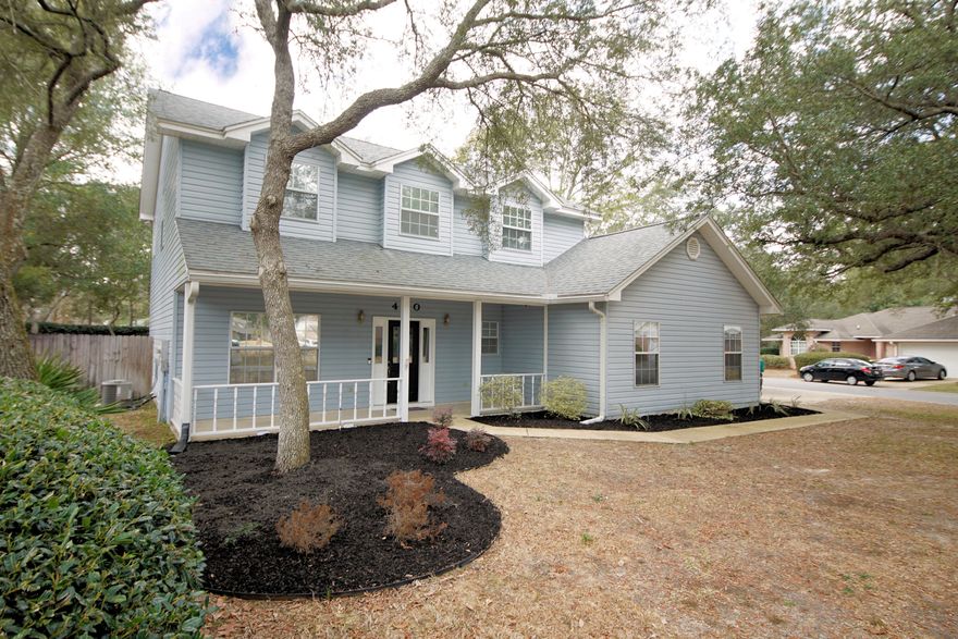 LOCATION IS KEY, Less than 1/2 mile from restaurants, shopping, Golf, Pools, Marina & Bluewater Bay Elementary.  Come check out this well acquainted 2 story traditional home on an oversized corner lot in one of the desired neighborhoods in Bluewater Bay! Roof is 2011 2 New HVAC in 2011 NEW tankless Gas Water Heater in 2021. All new Paint in 2021. Enjoy watching your day go by on the beautiful front porch. Once inside you will be greeted by an oversized living room, which could be used in conjunction with a dining space. As you continue through the home you will find an updated kitchen complete with stainless steel appliances, granite countertops, breakfast bar and oversized pantry. This leads into another living room adorned by a wood burning fireplace and french doors to the covered patio